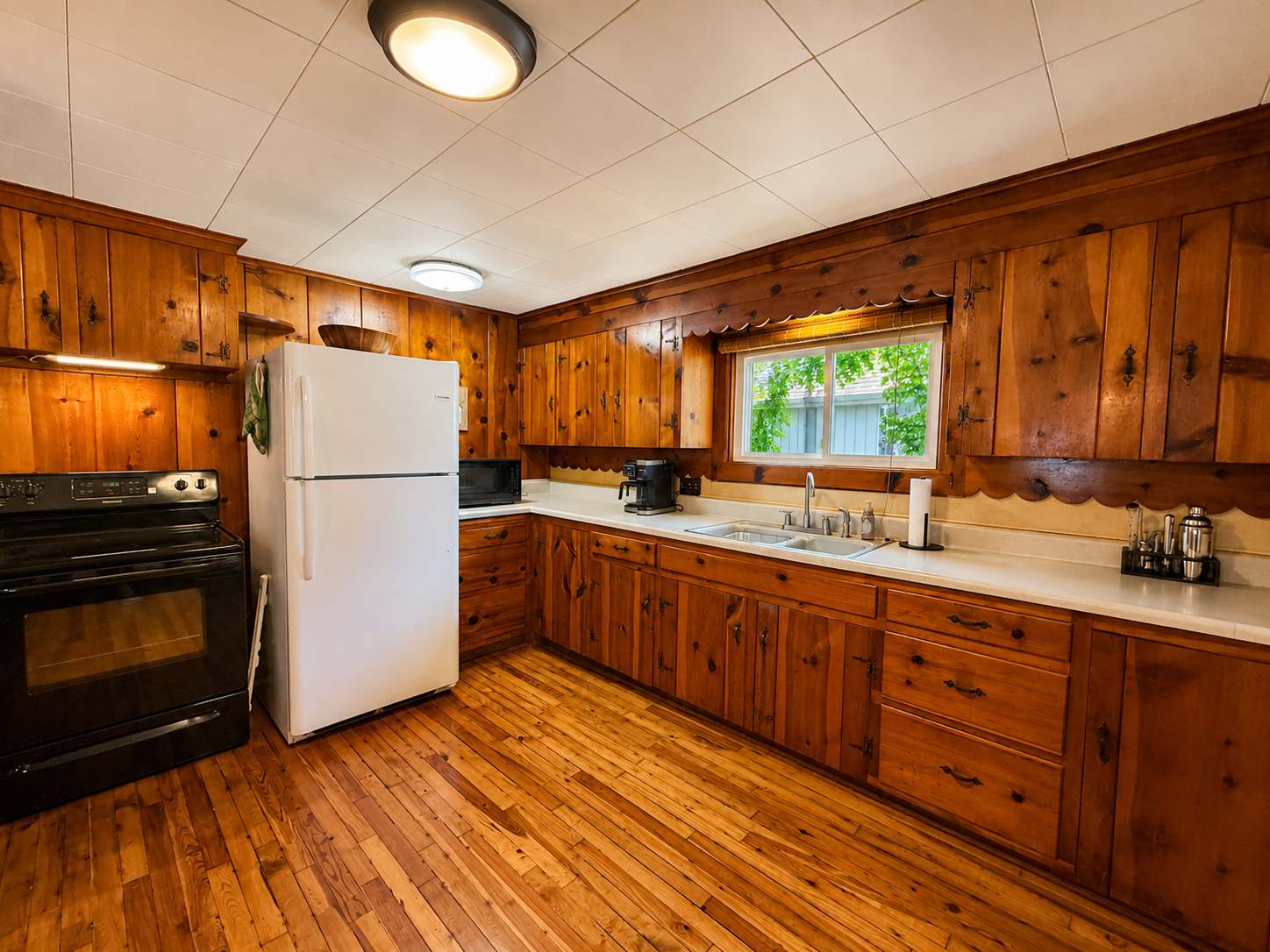 The rustic kitchen offers ample space & all the comforts of home​