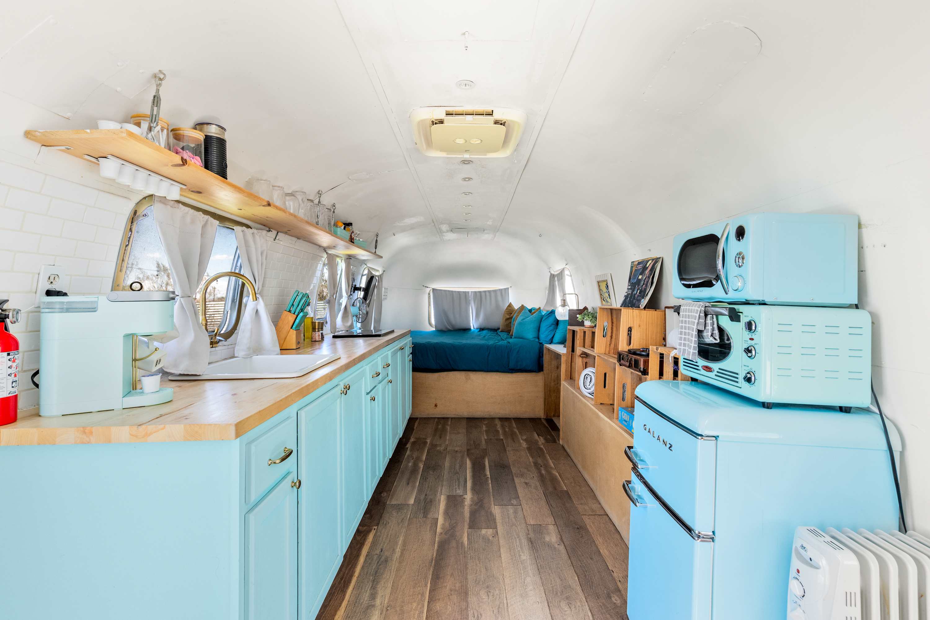 Perfect Kitchenette providing the essentials to the left and decorative crate storage for nesting during your stay