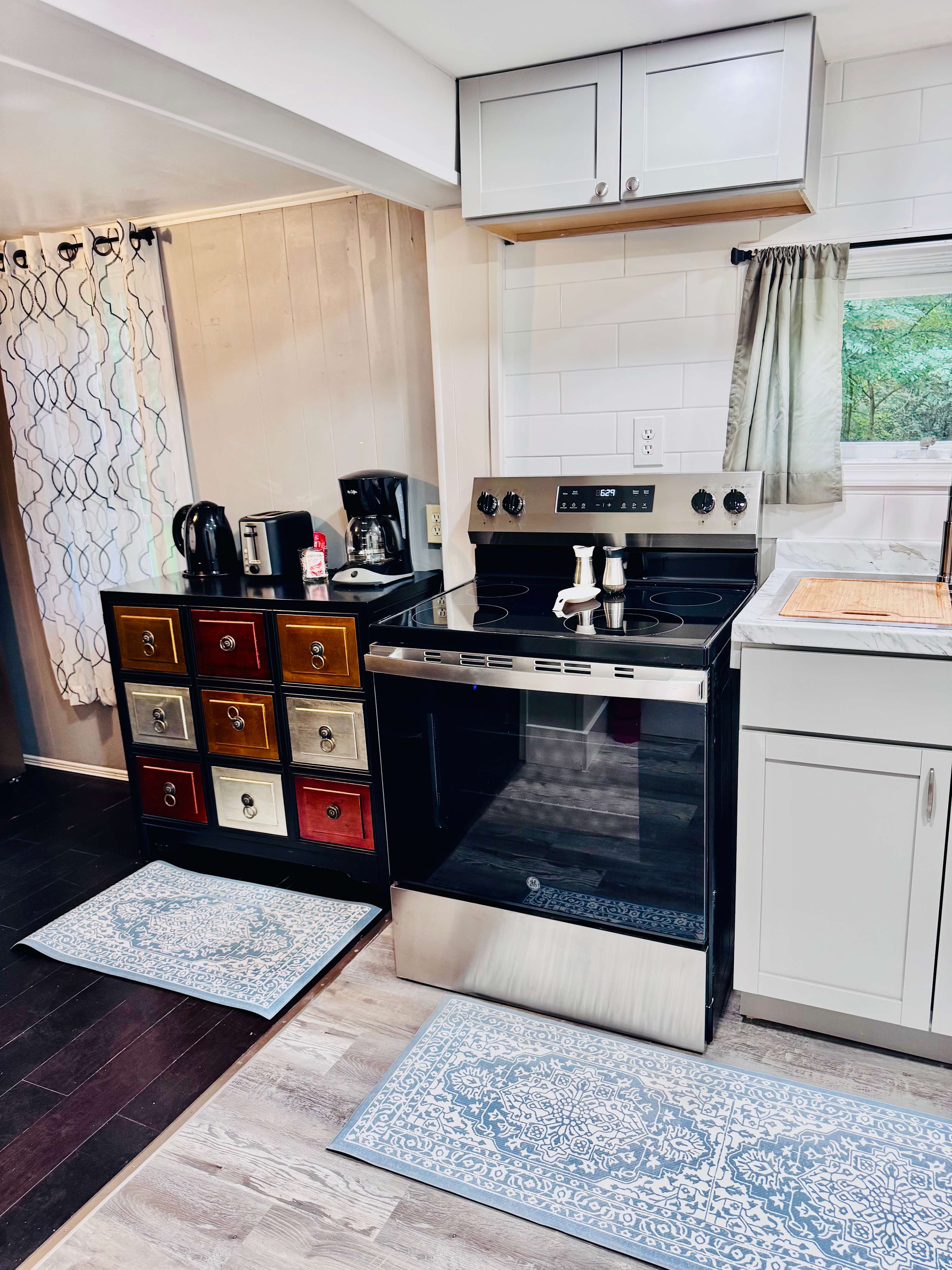 Kitchen opens to the 4 person dining area and coffee bar.