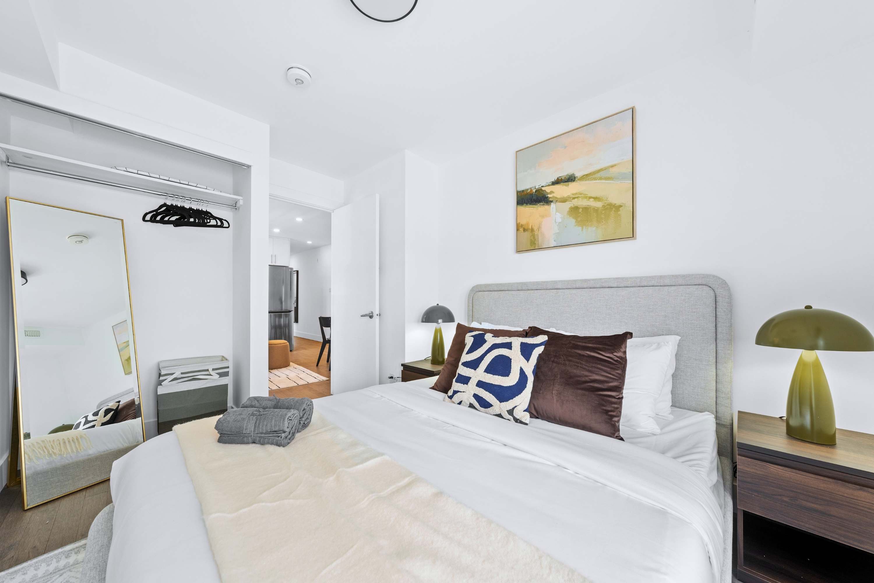 Includes a queen bed and spacious mirrored wardrobe for convenient luggage storage.