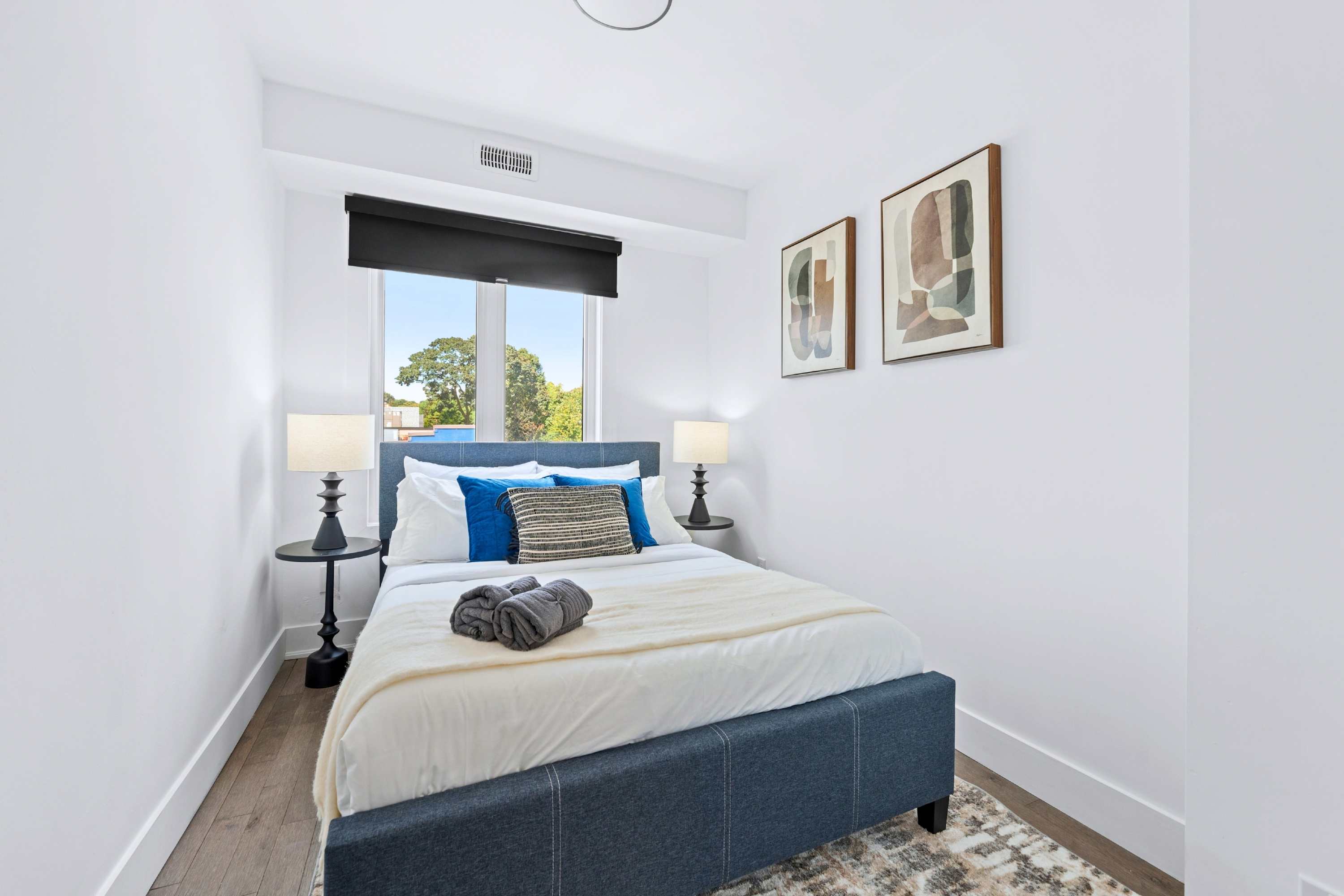 Private third bedroom featuring a double bed and blackout blinds for quality sleep.