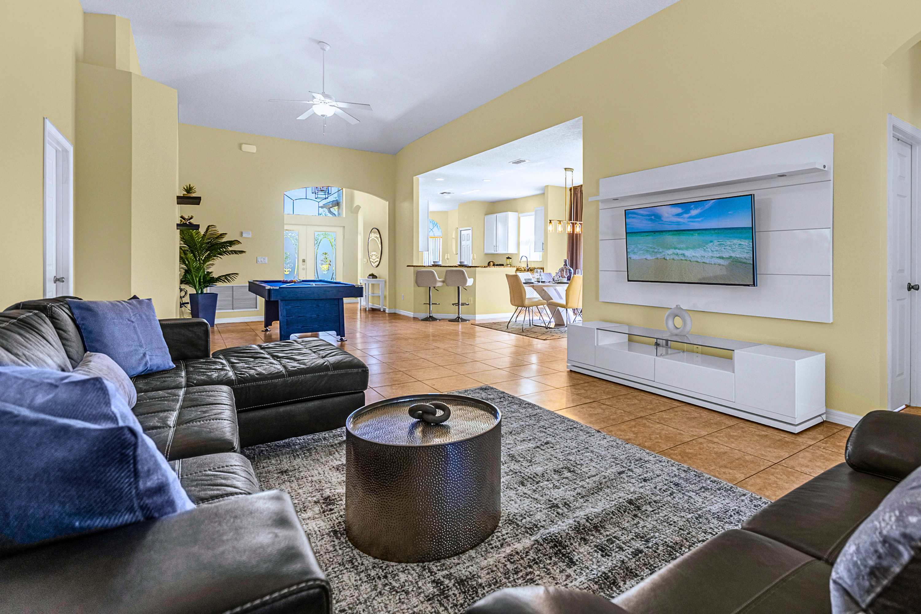 Everything in one spot: open kitchen, large living area, and billiards