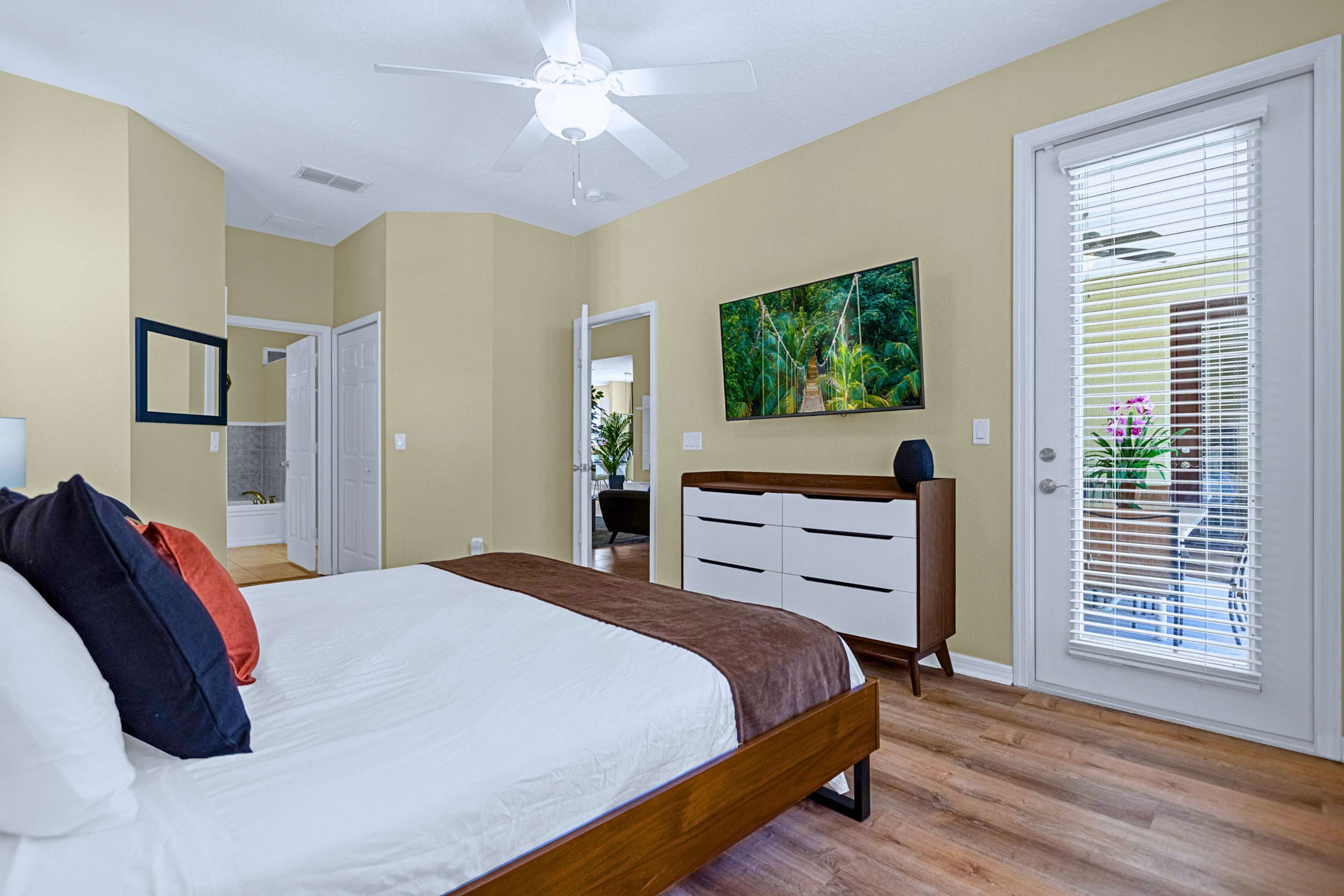 Wake up steps from the pool: queen bed, TV, ceiling fan & private bath.