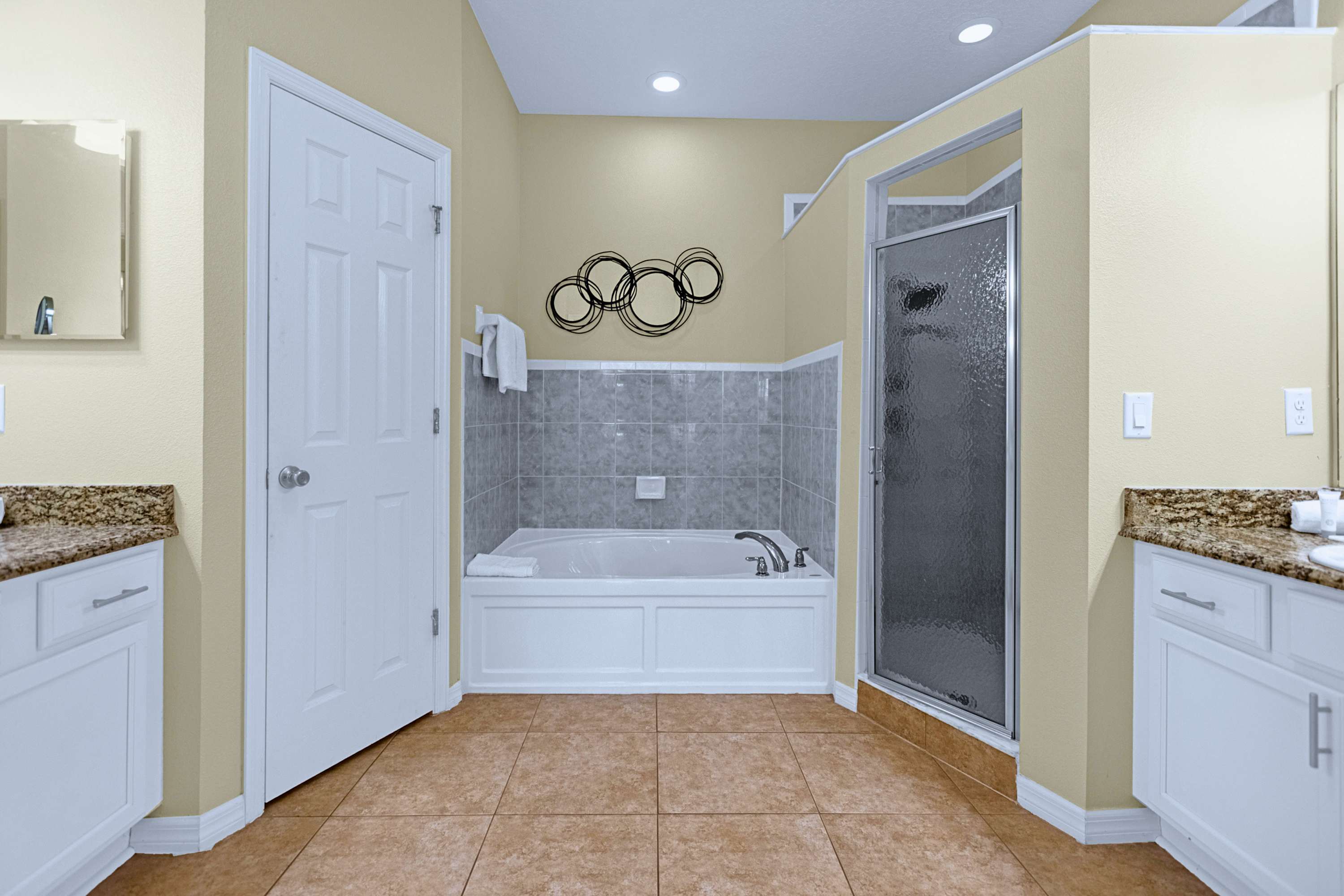 Full private ensuite bathroom complete with deep bathtub, shower & vanity