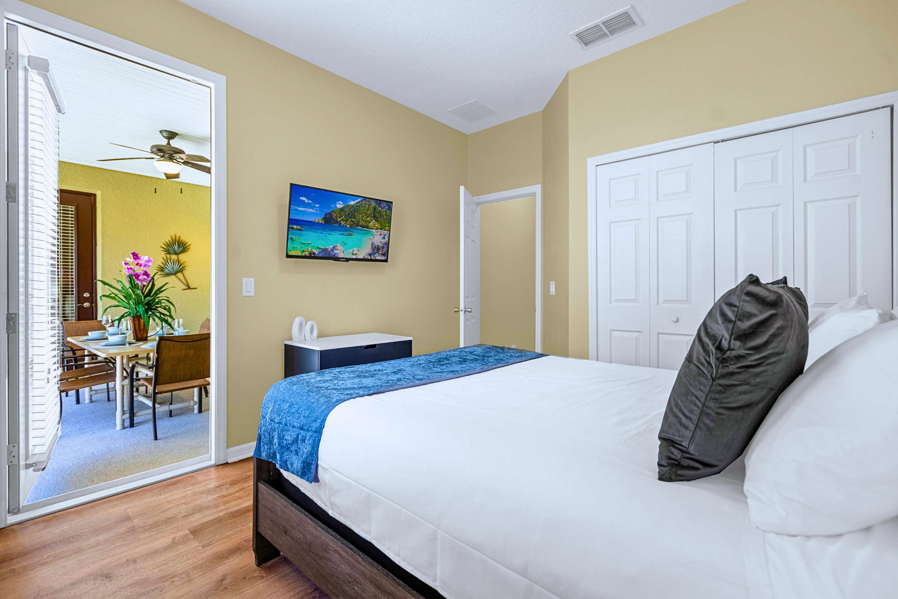 Wake up & swim: queen suite with crisp linens, TV, and direct pool access.