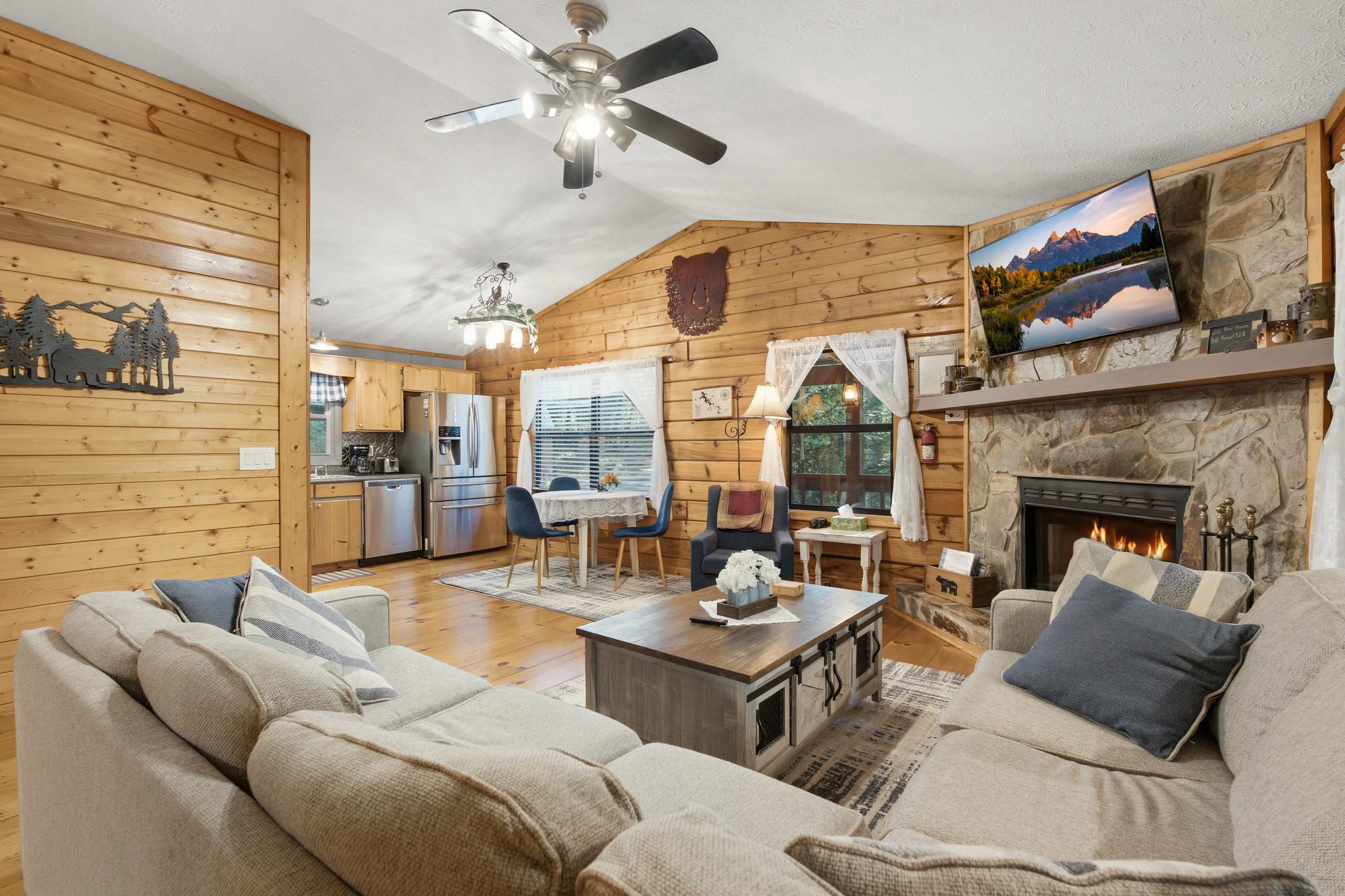 Gather, dine, and relax with ease in this spacious open-concept living, dining, and kitchen area