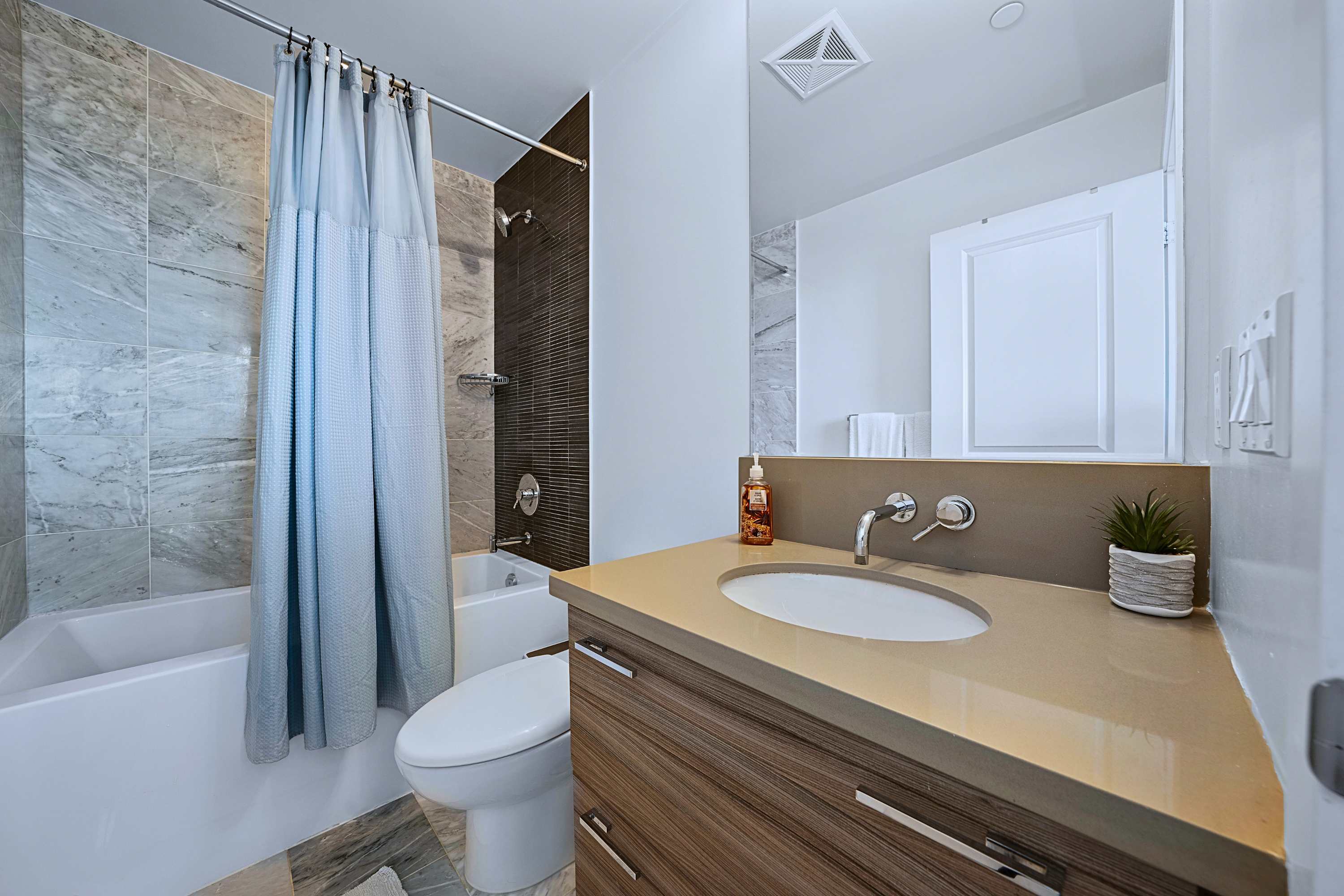 Private ensuite bathroom with bathtub