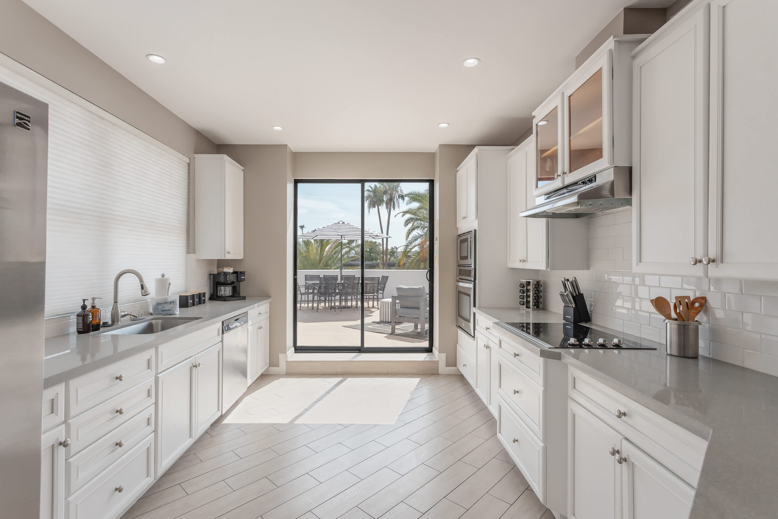 Modern kitchen featuring stainless steel appliances, generous counter space, and a breakfast bar perfect for casual dining and morning coffee.