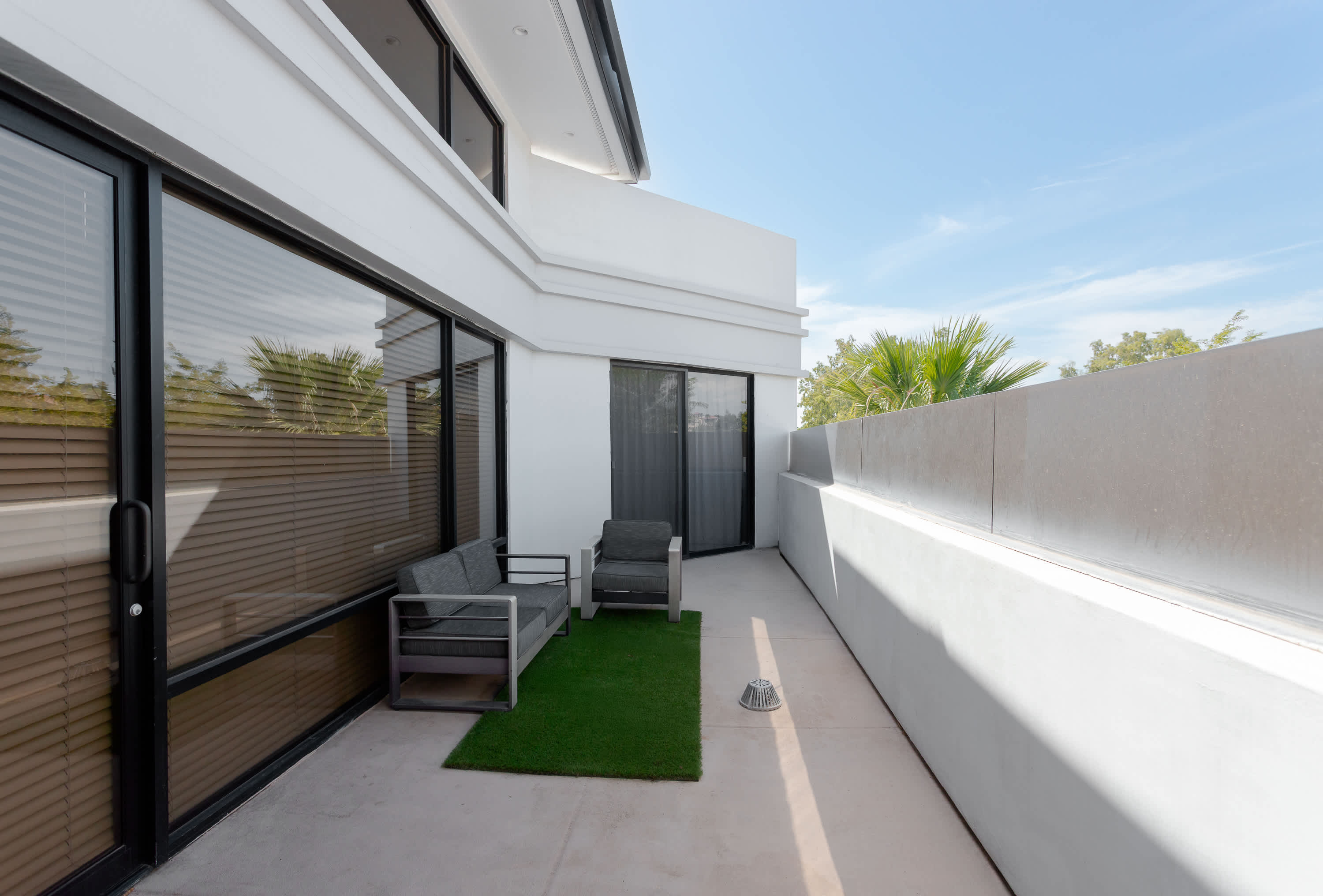Private Patio off Primary bedroom with outdoor seating area.