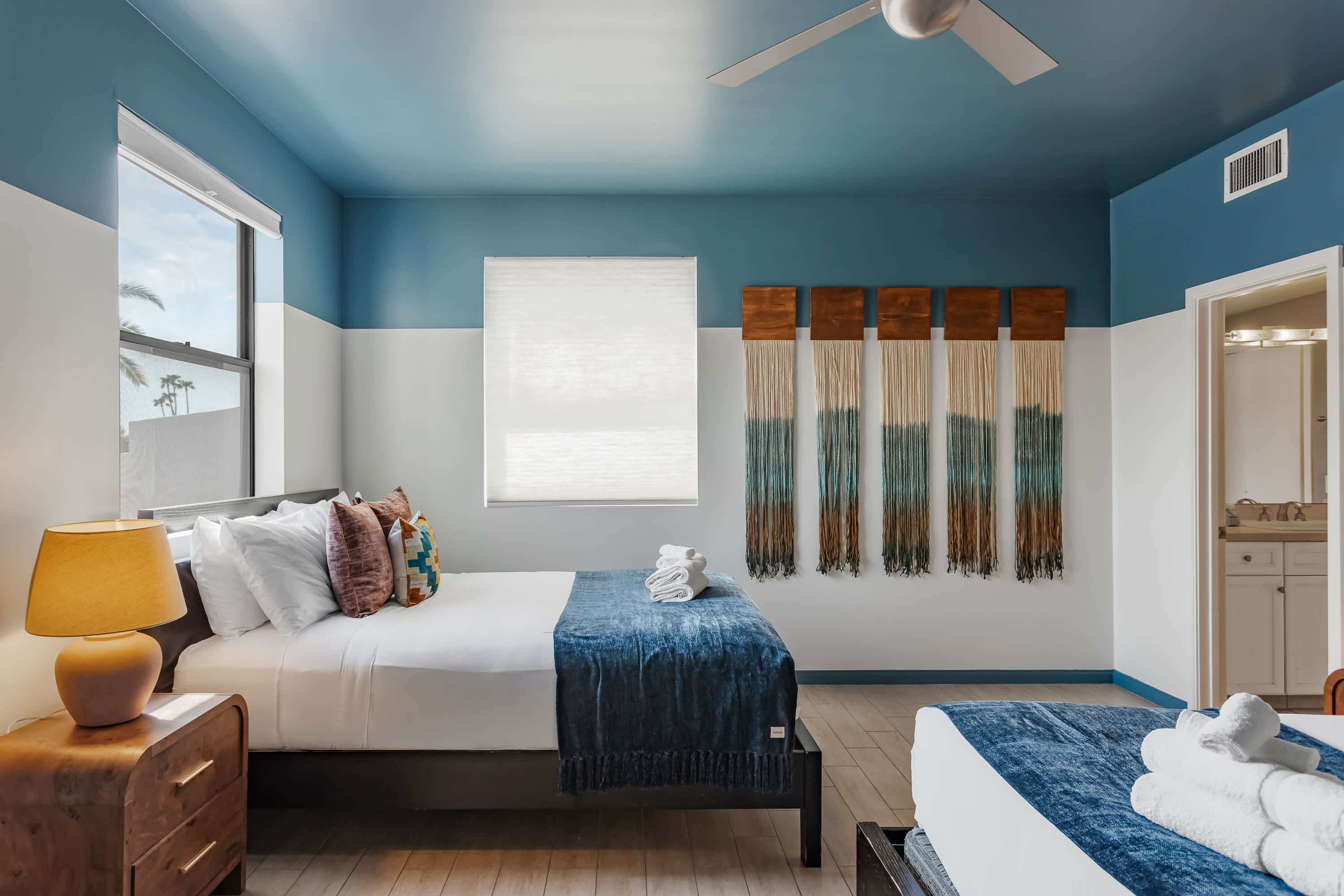 Second bedroom featuring two Queen beds, direct access to the Jack-and-Jill bathroom, and a spacious layout designed for a comfortable and restful stay.