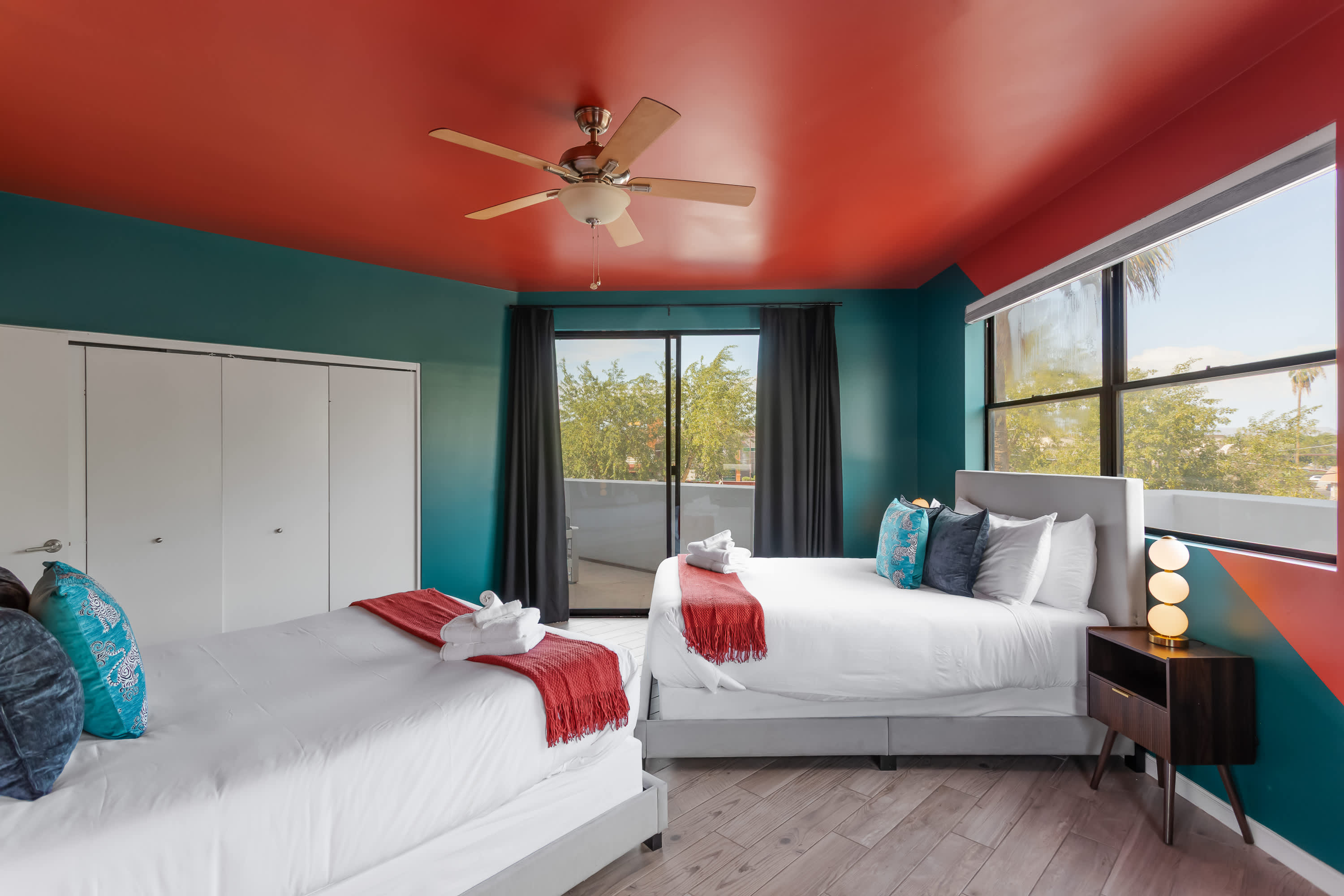 Comfortable 2nd bedroom with two Queen beds, private balcony access, and easy access to the Jack-and-Jill bathroom.