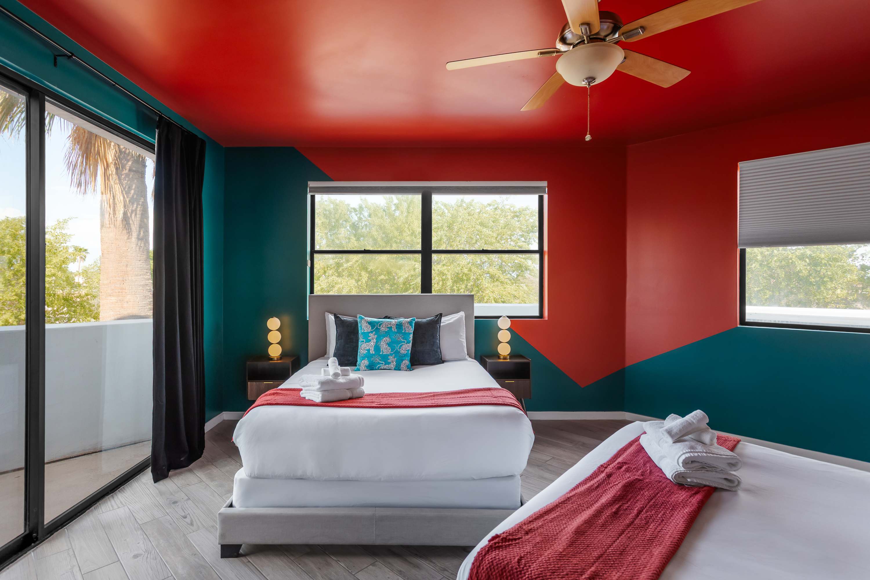 Comfortable 2nd bedroom with two Queen beds, private balcony access, and easy access to the Jack-and-Jill bathroom.