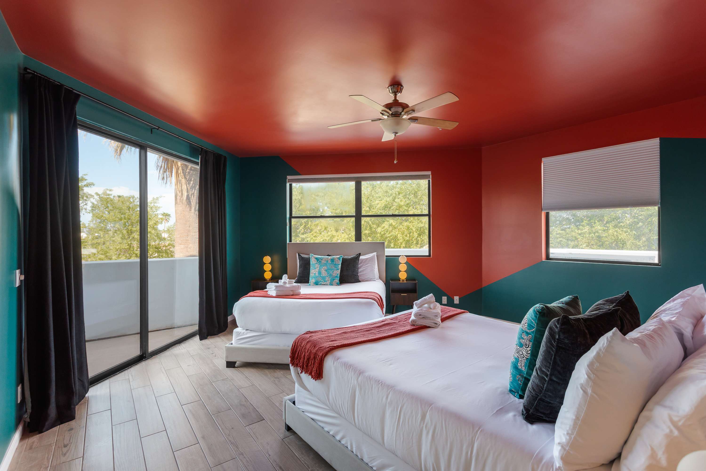 Comfortable 2nd bedroom with two Queen beds, private balcony access, and easy access to the Jack-and-Jill bathroom.