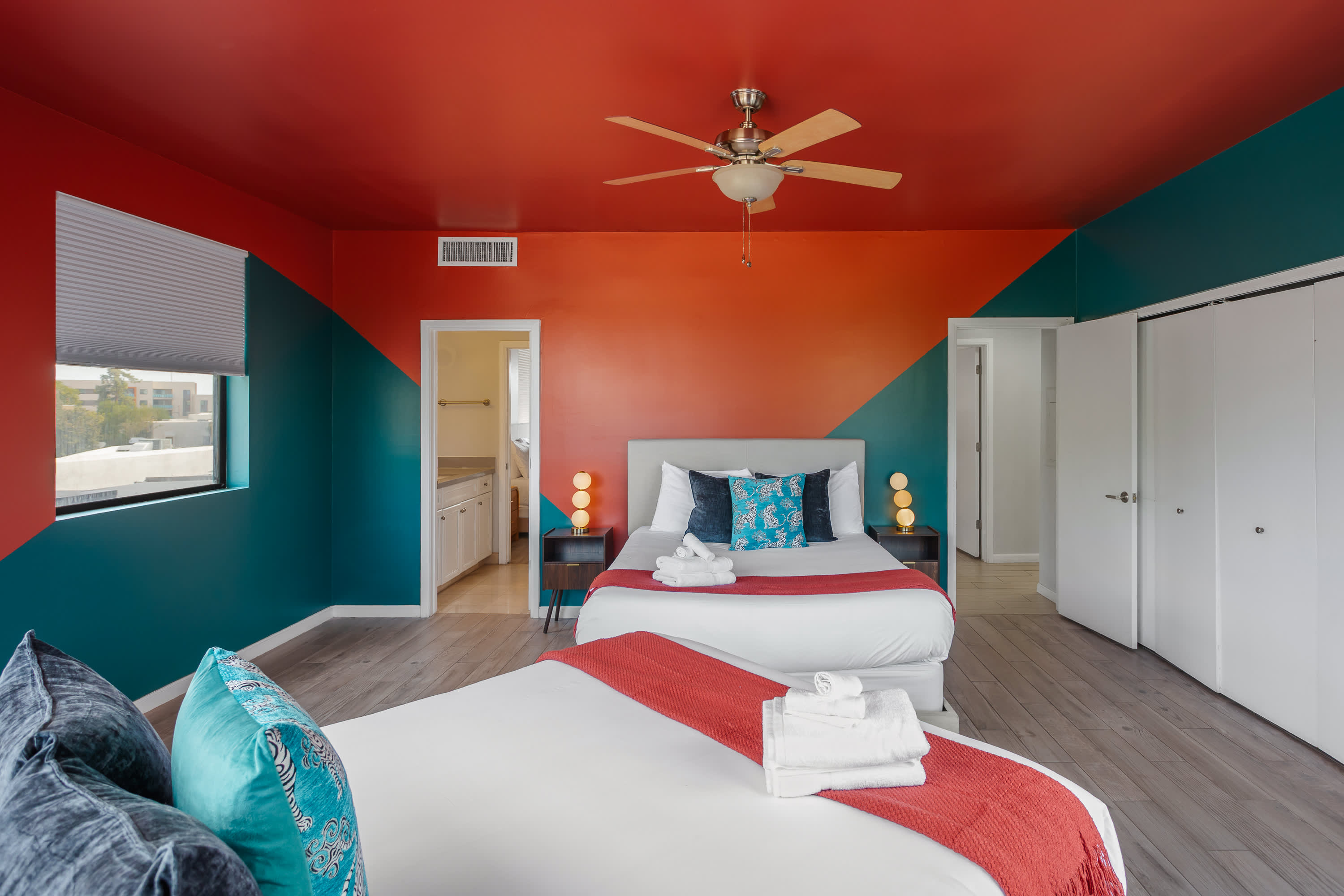Comfortable 2nd bedroom with two Queen beds, private balcony access, and easy access to the Jack-and-Jill bathroom.