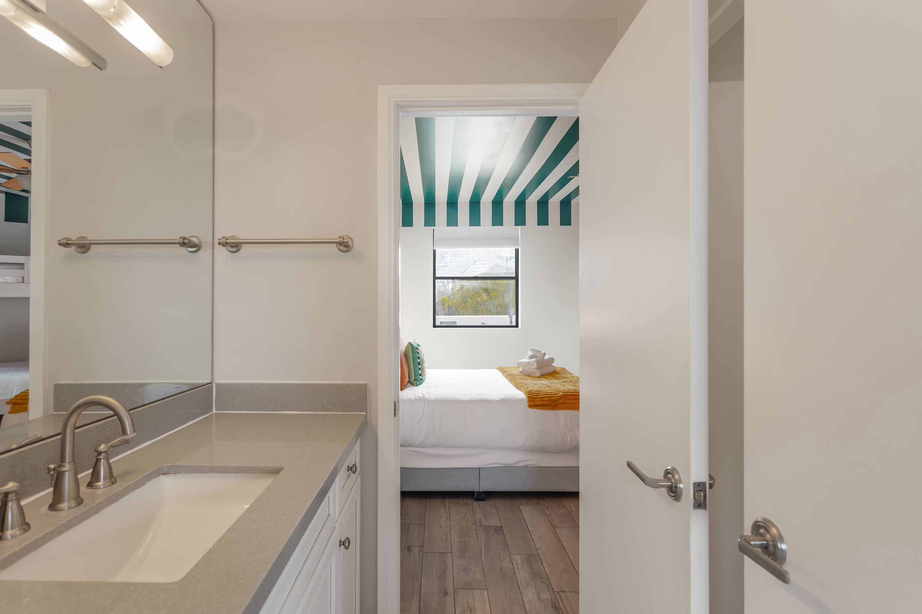 Convenient Jack-and-Jill bathroom with a spacious vanity, shower and tub combo, and shared access, ideal for guests staying in the adjoining bedrooms.