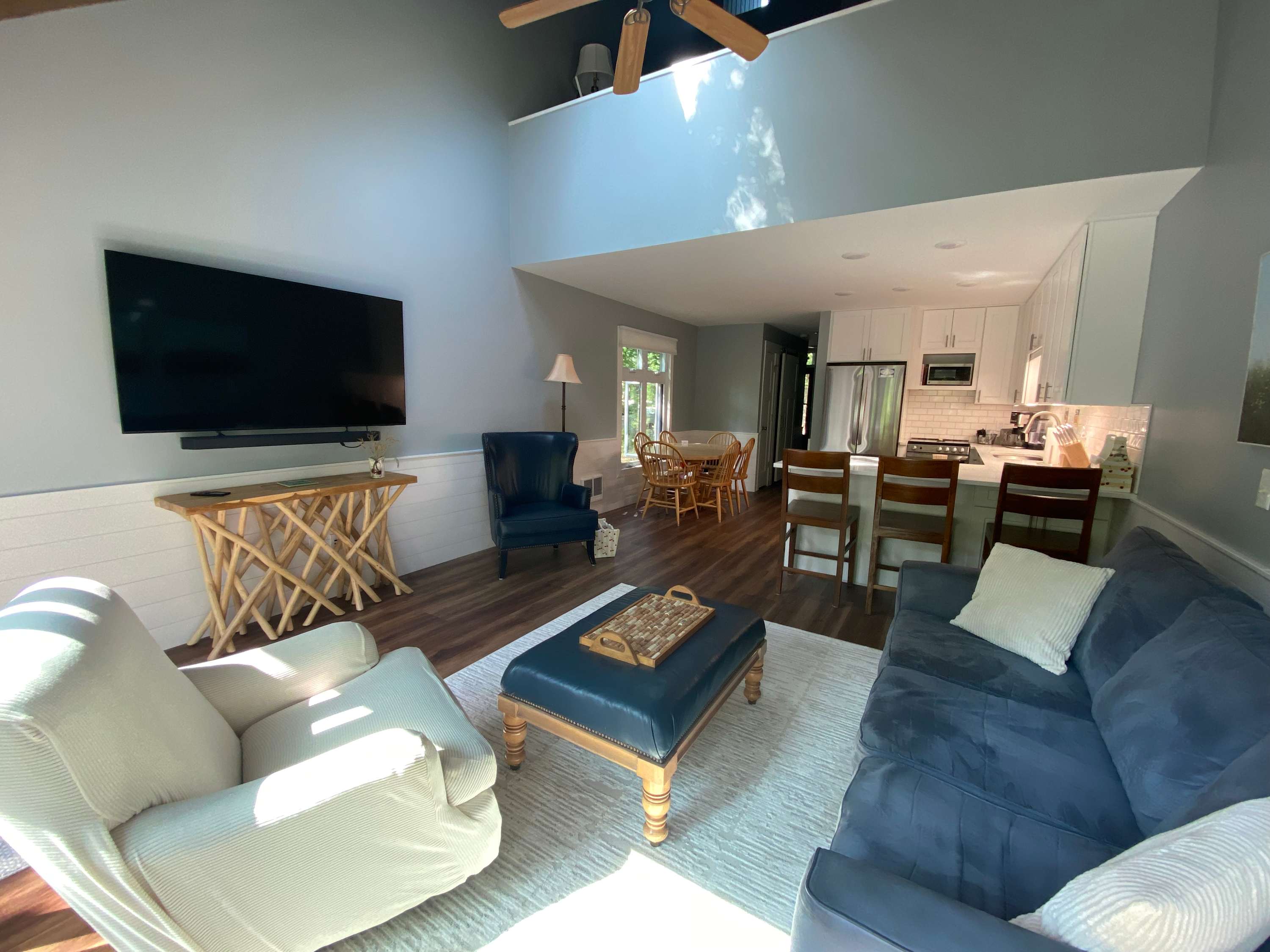 River-view condo with fireplace, deck, washer & dryer, and community firepit