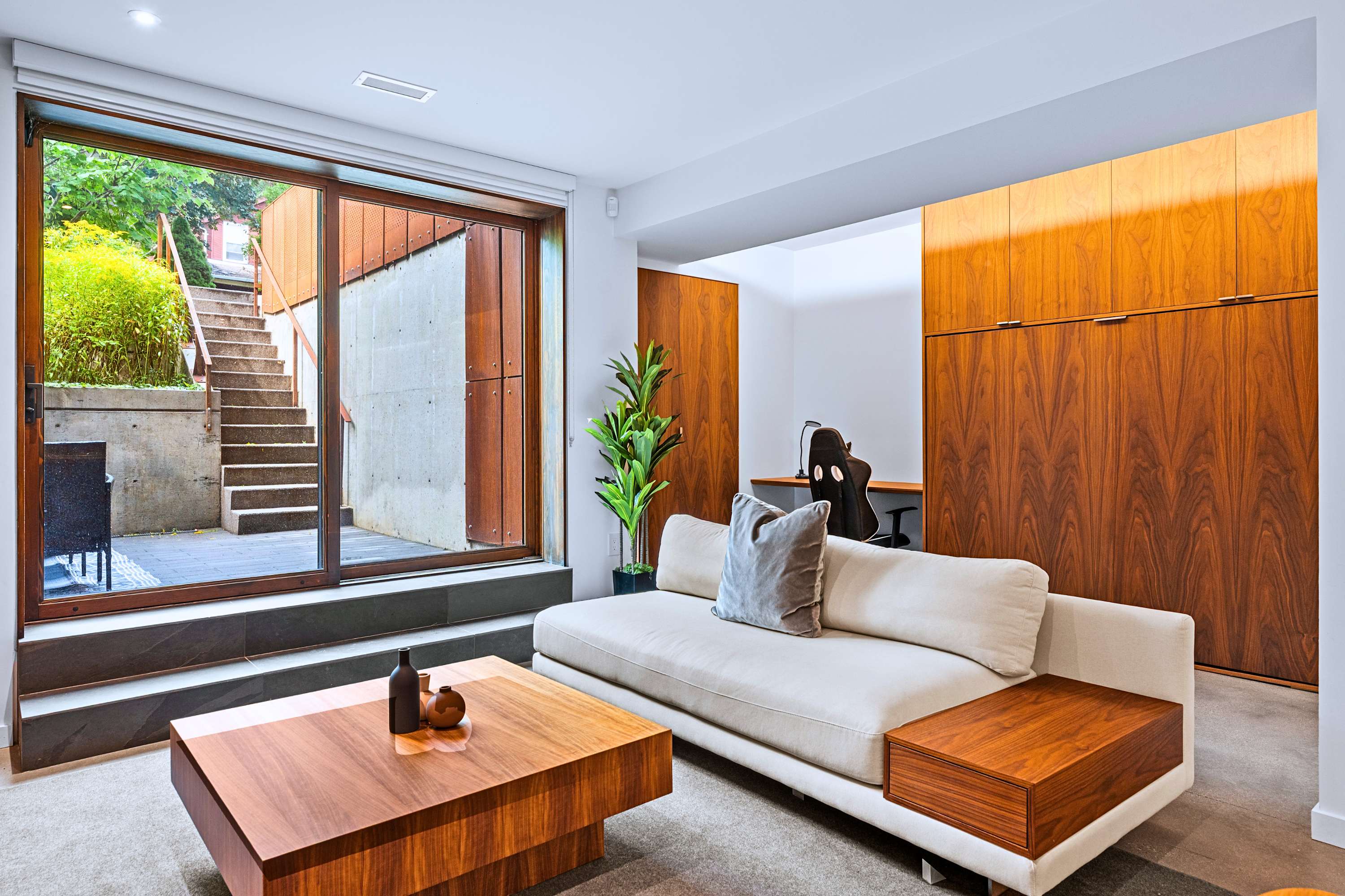 Direct courtyard access creates an open, tranquil atmosphere throughout.