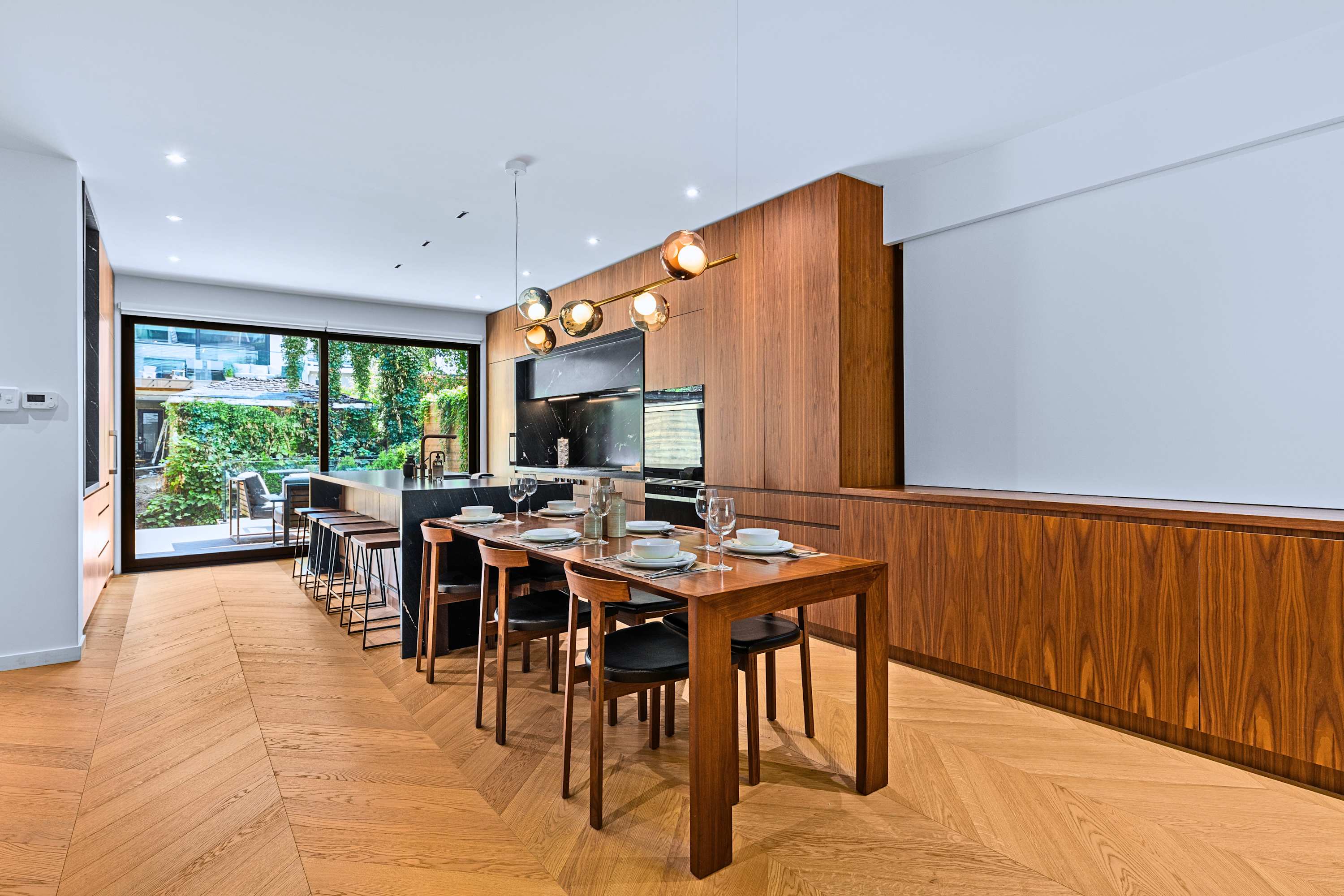 Open-concept dining and kitchen layout designed for effortless hosting.
