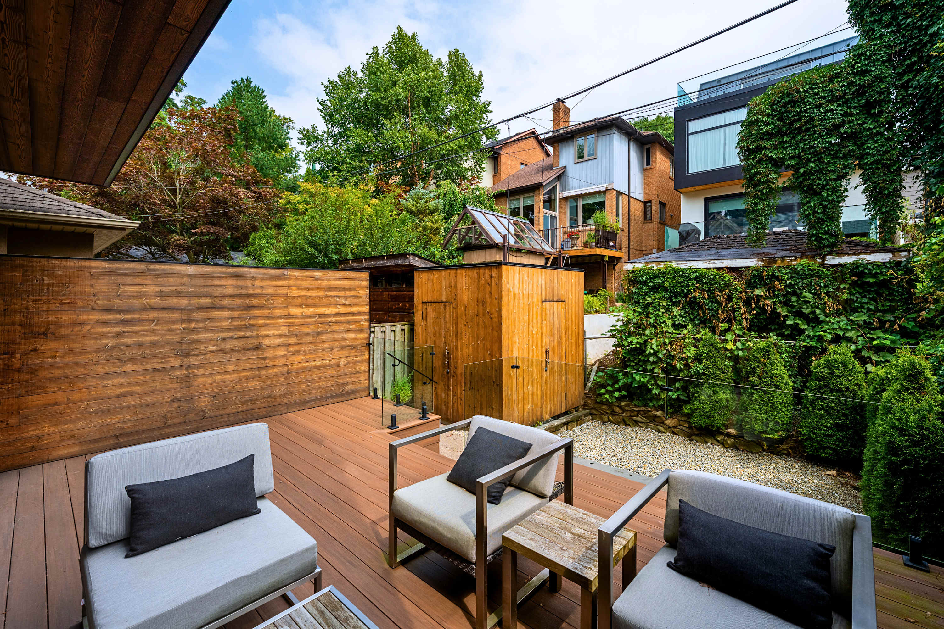 Outdoor lounge area tucked away in a quiet, fully fenced backyard sanctuary.