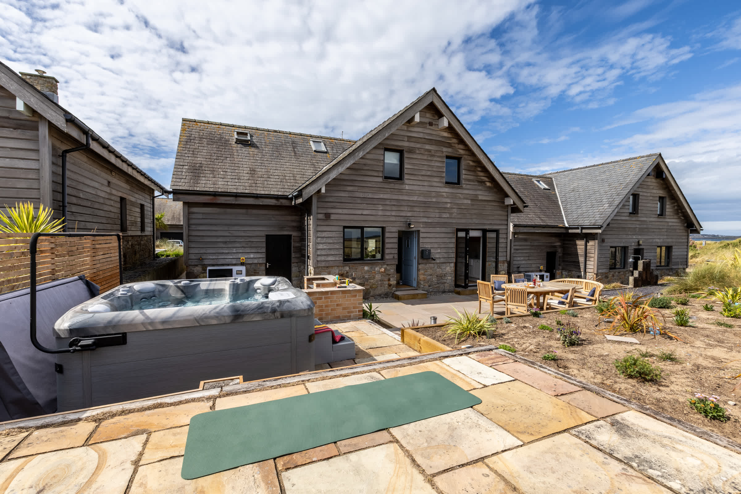 Private hot tub on the beachfront terrace beneath the stars, holiday home sleeping eight in Rhosneigr, Anglesey