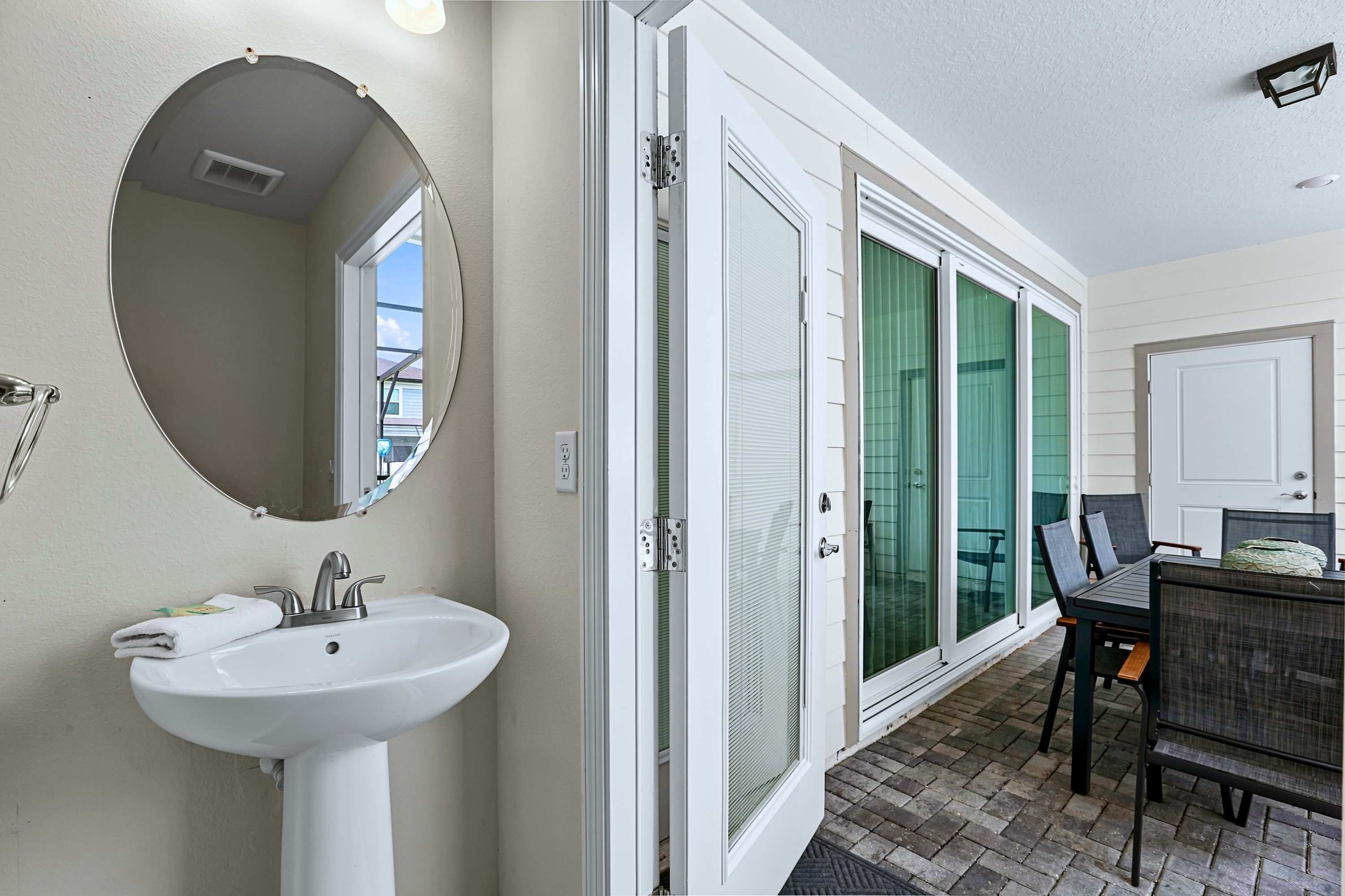 Convenient poolside half bath—perfect for a quick cleanup without tracking water inside.