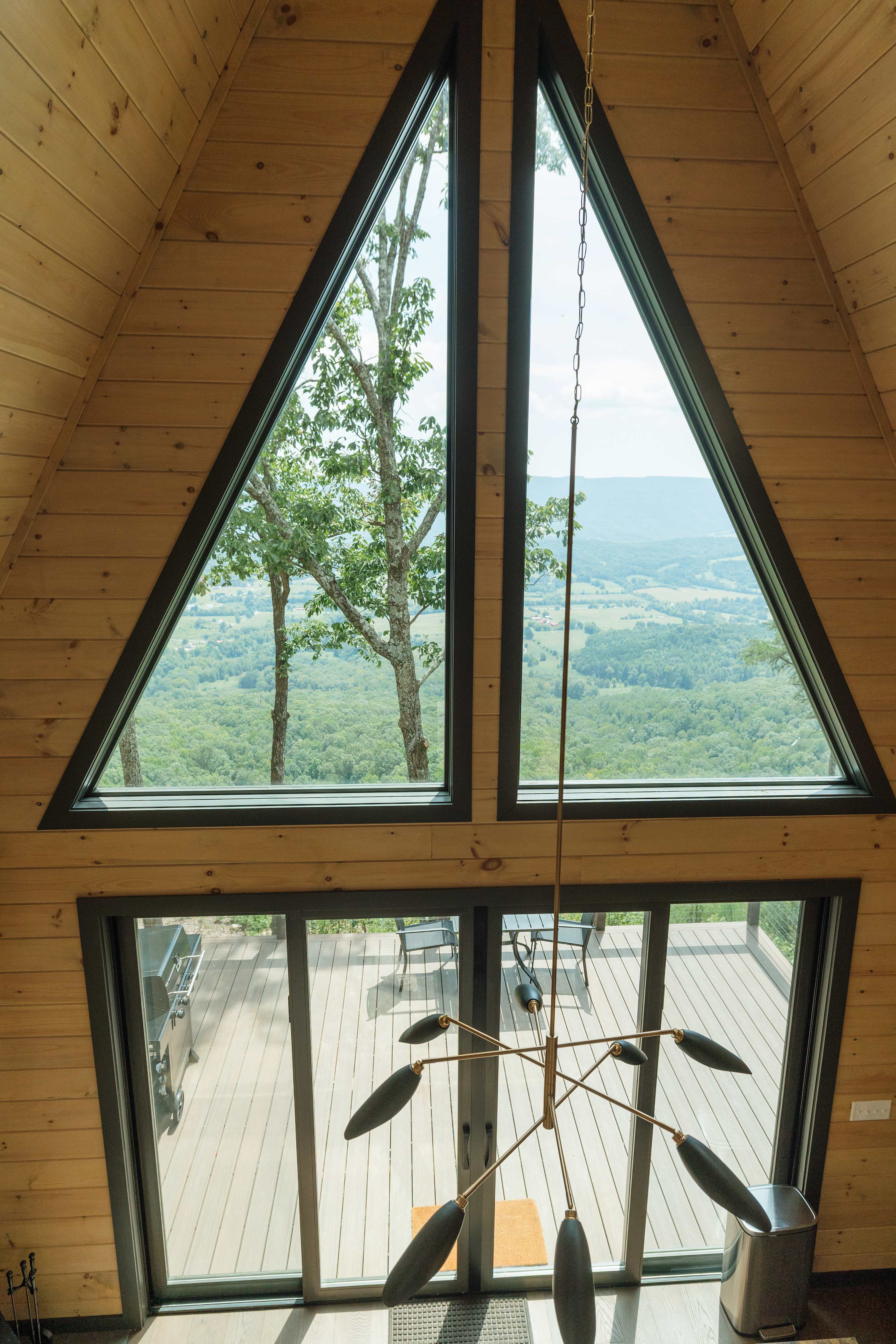 Take in panoramic views through the cabin’s stunning windows.