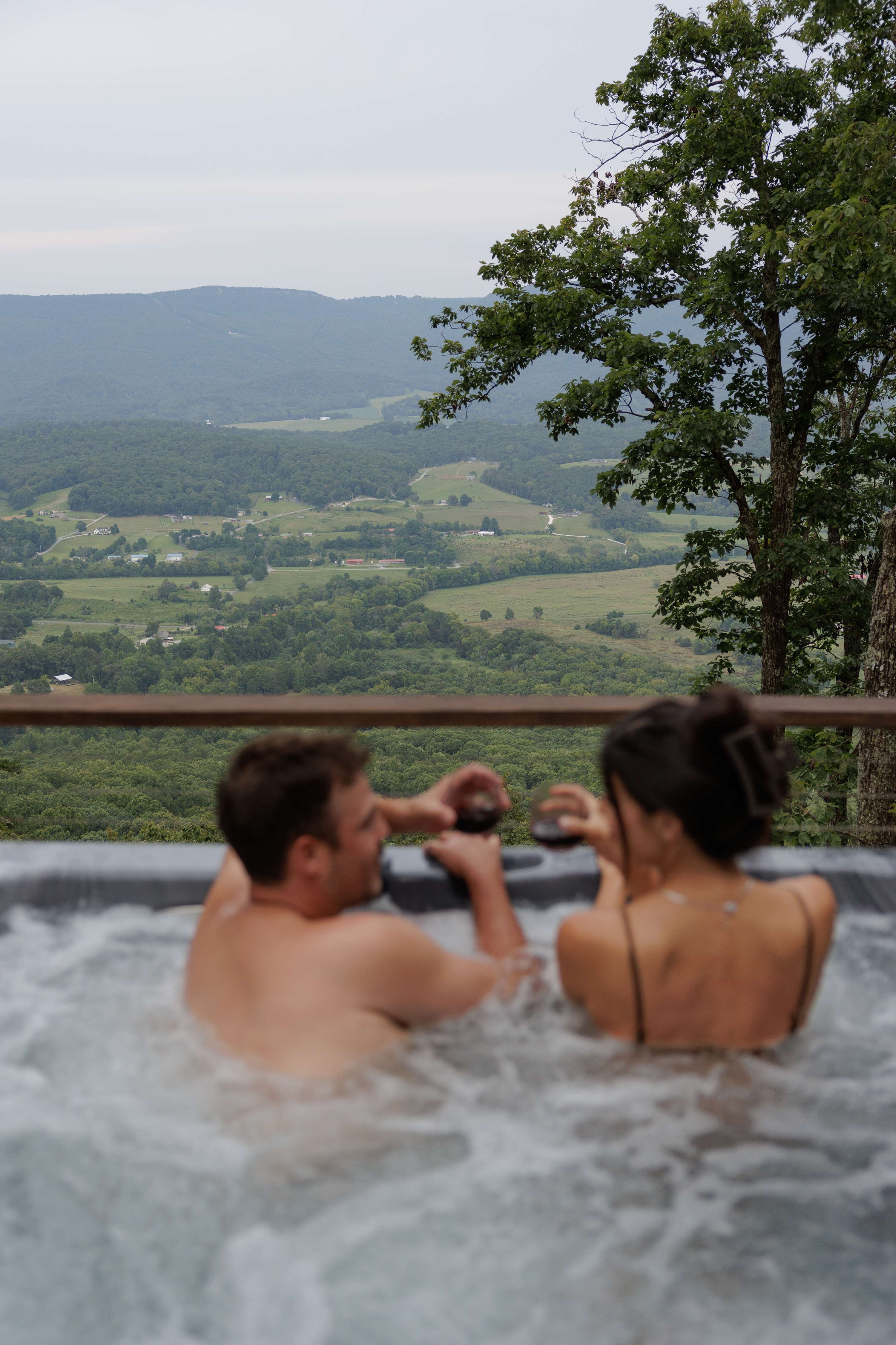 A fresh view of the hot tub and peaceful mountain landscape.