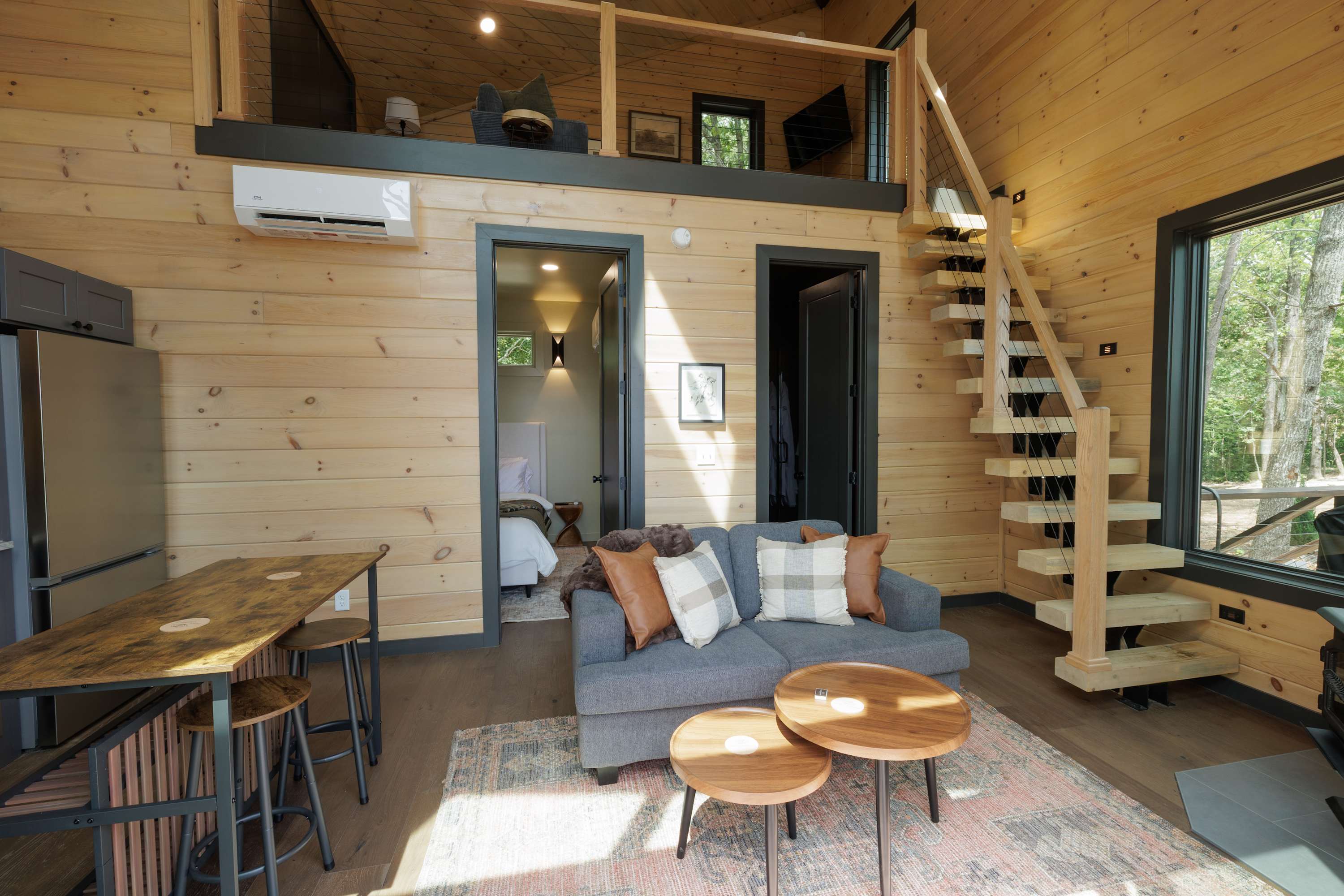 Relax in the inviting living space with easy access to the cabin rooms.