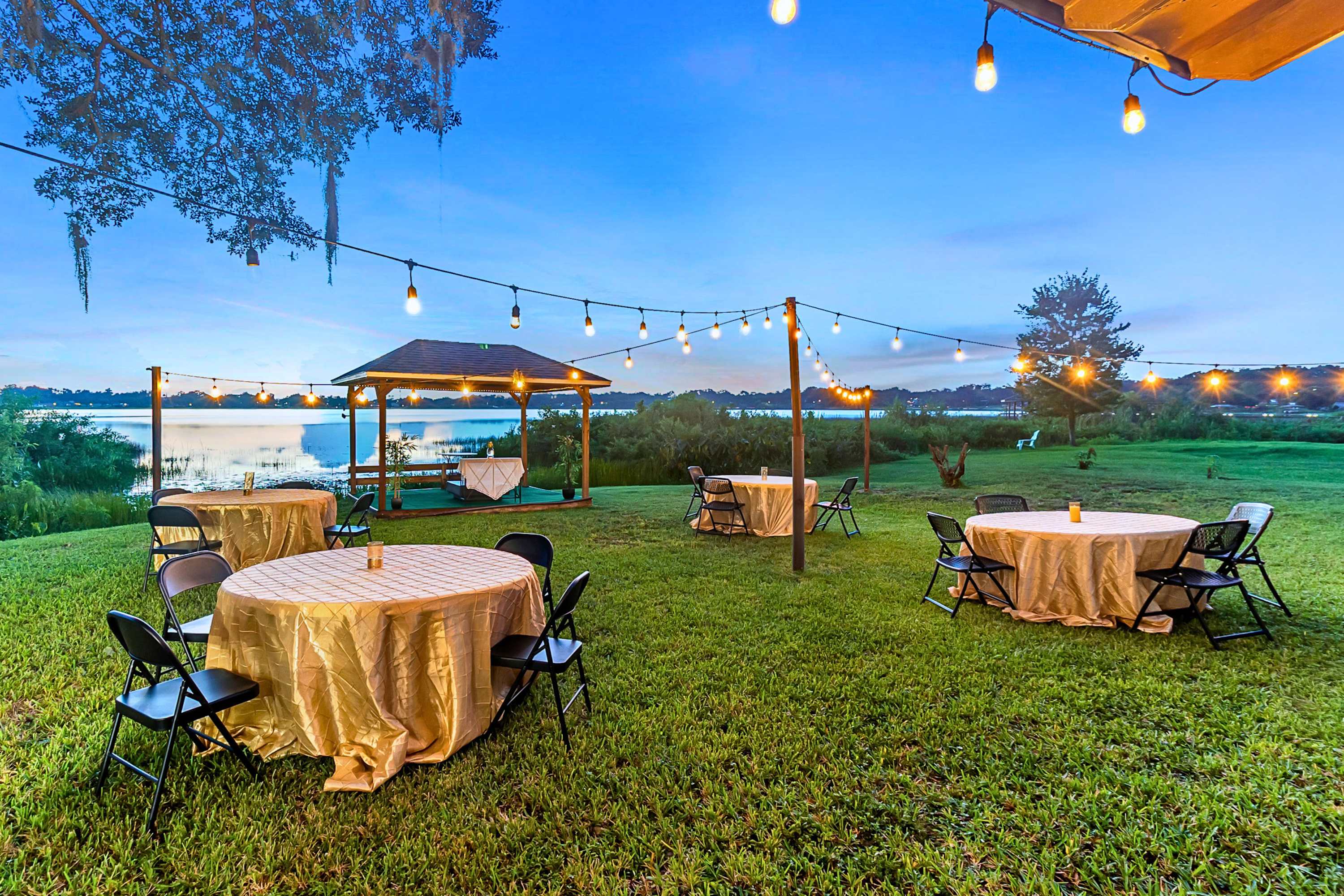 Relax under the evening lights or book this outdoor table setup for your special occasion