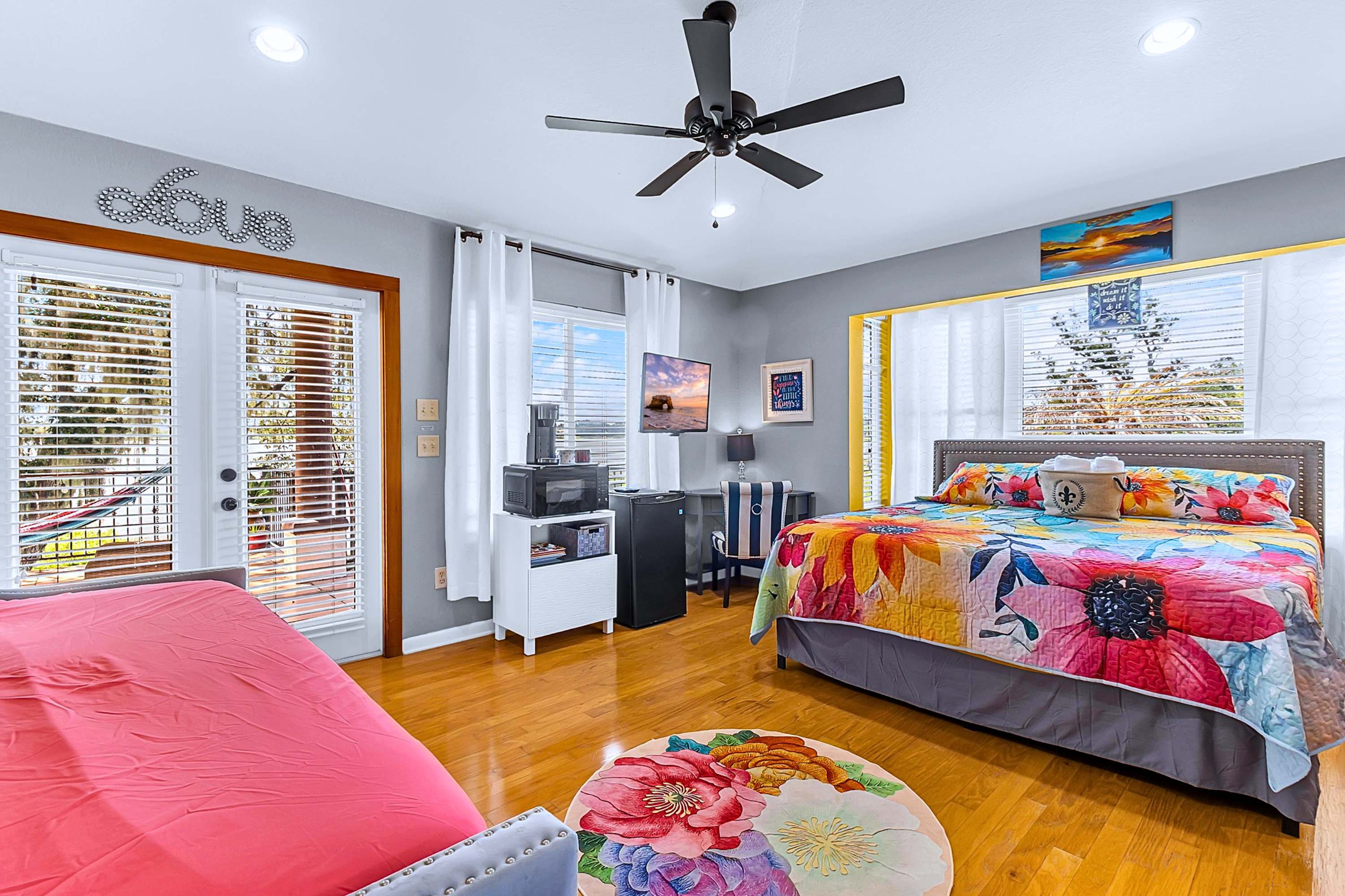 Enjoy a king bed, fan, corner table, and handy kitchenette with scenic terrace access