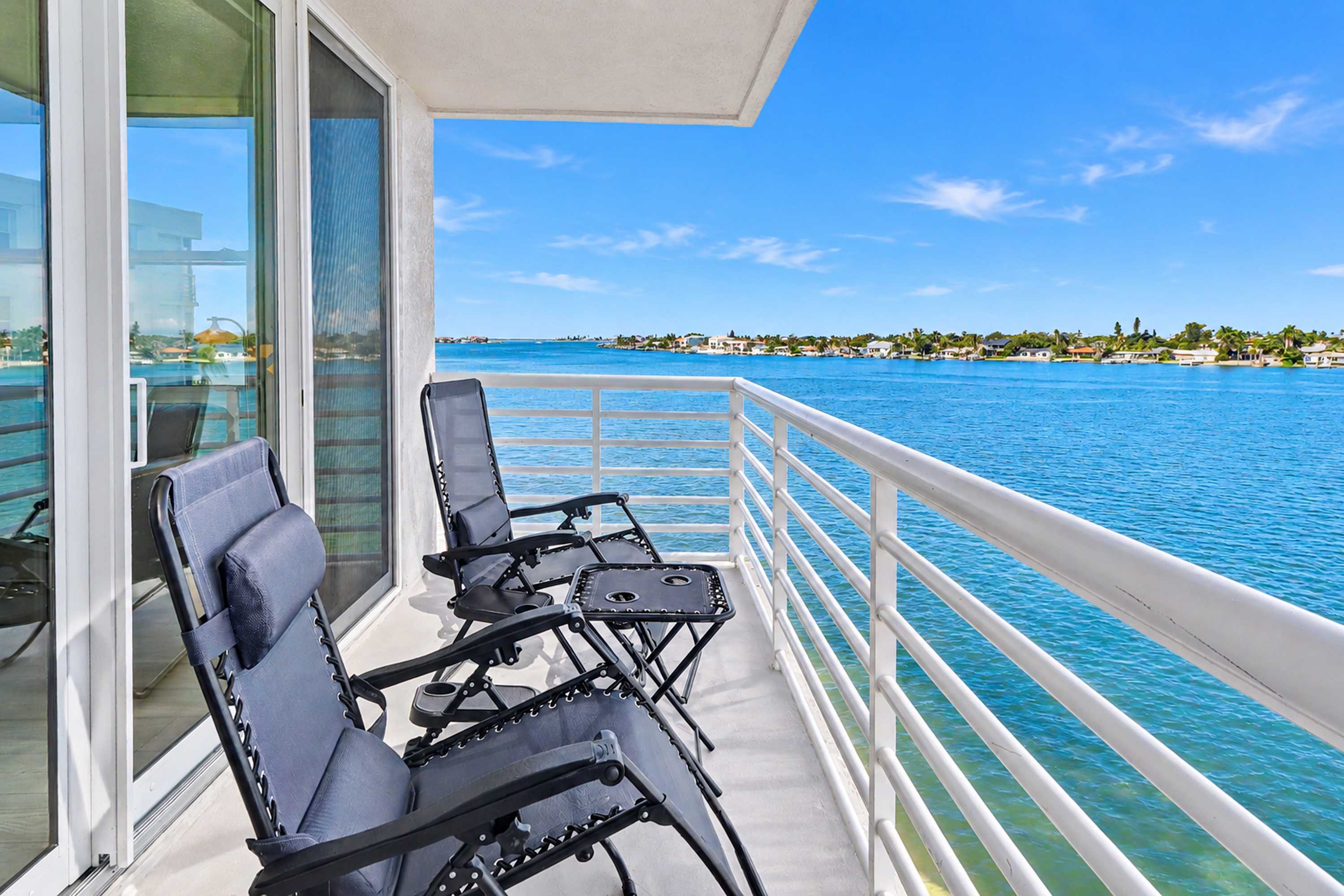 Water view condo with private beach pool and hot tub snowbird friendly
