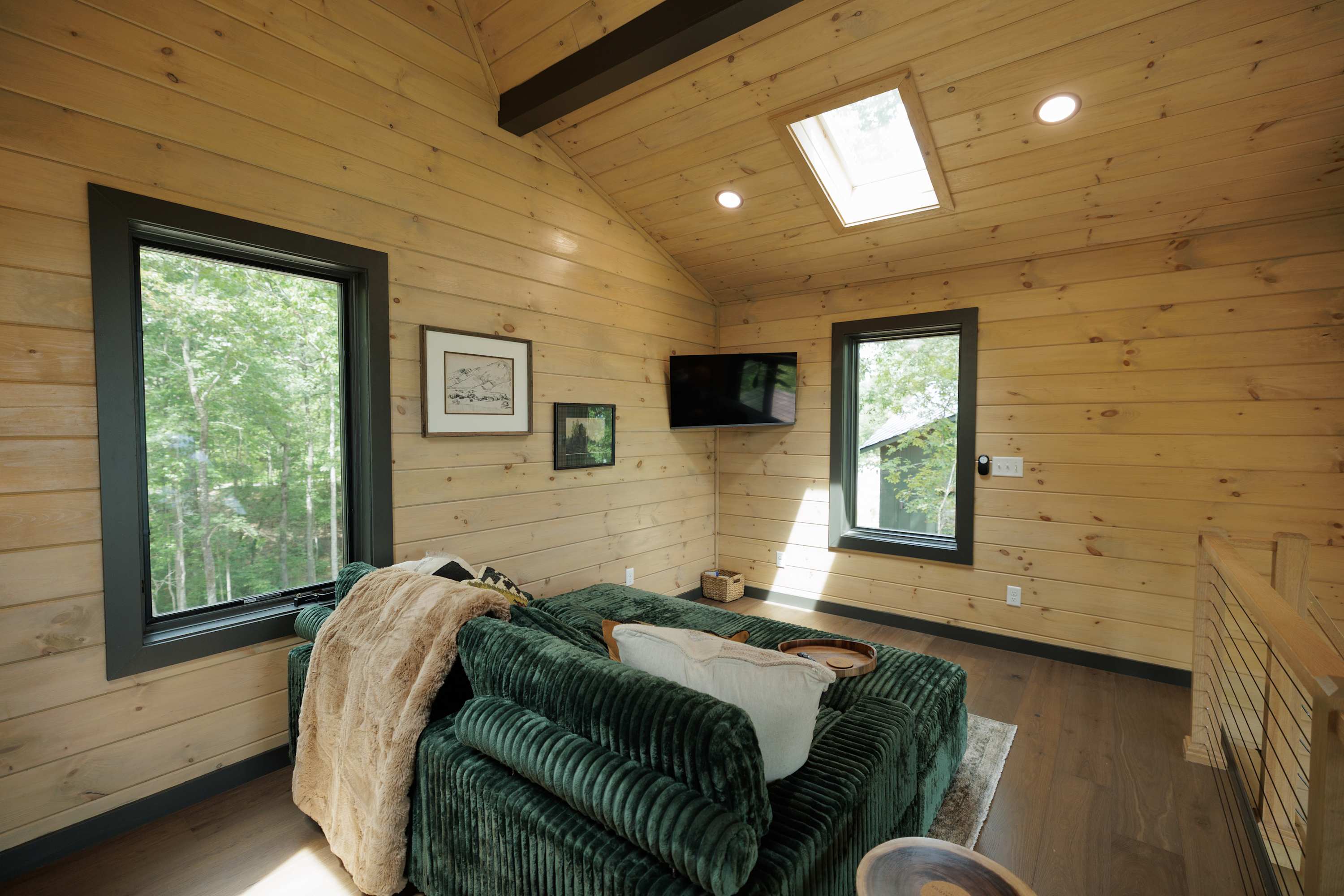 Cozy Bedroom with Skylight & Forest Views