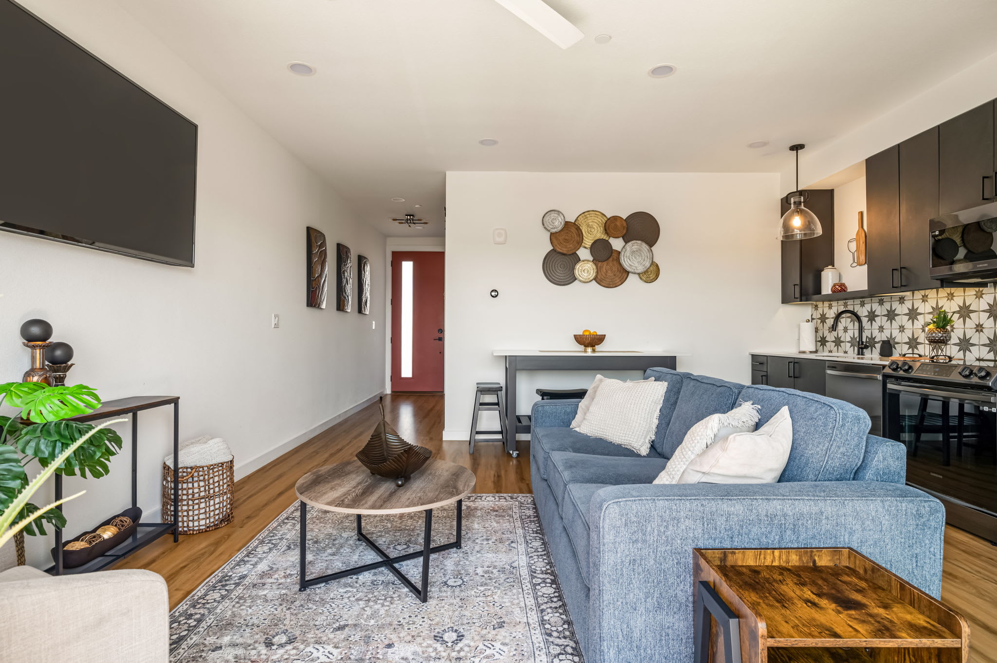 Living room with smart TV above the sofa