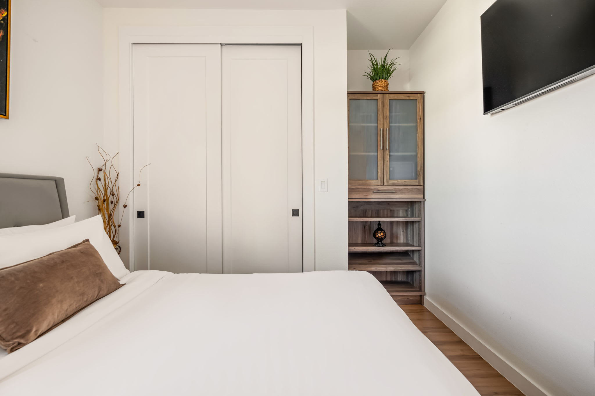 Bedroom with wall-mounted smart TV