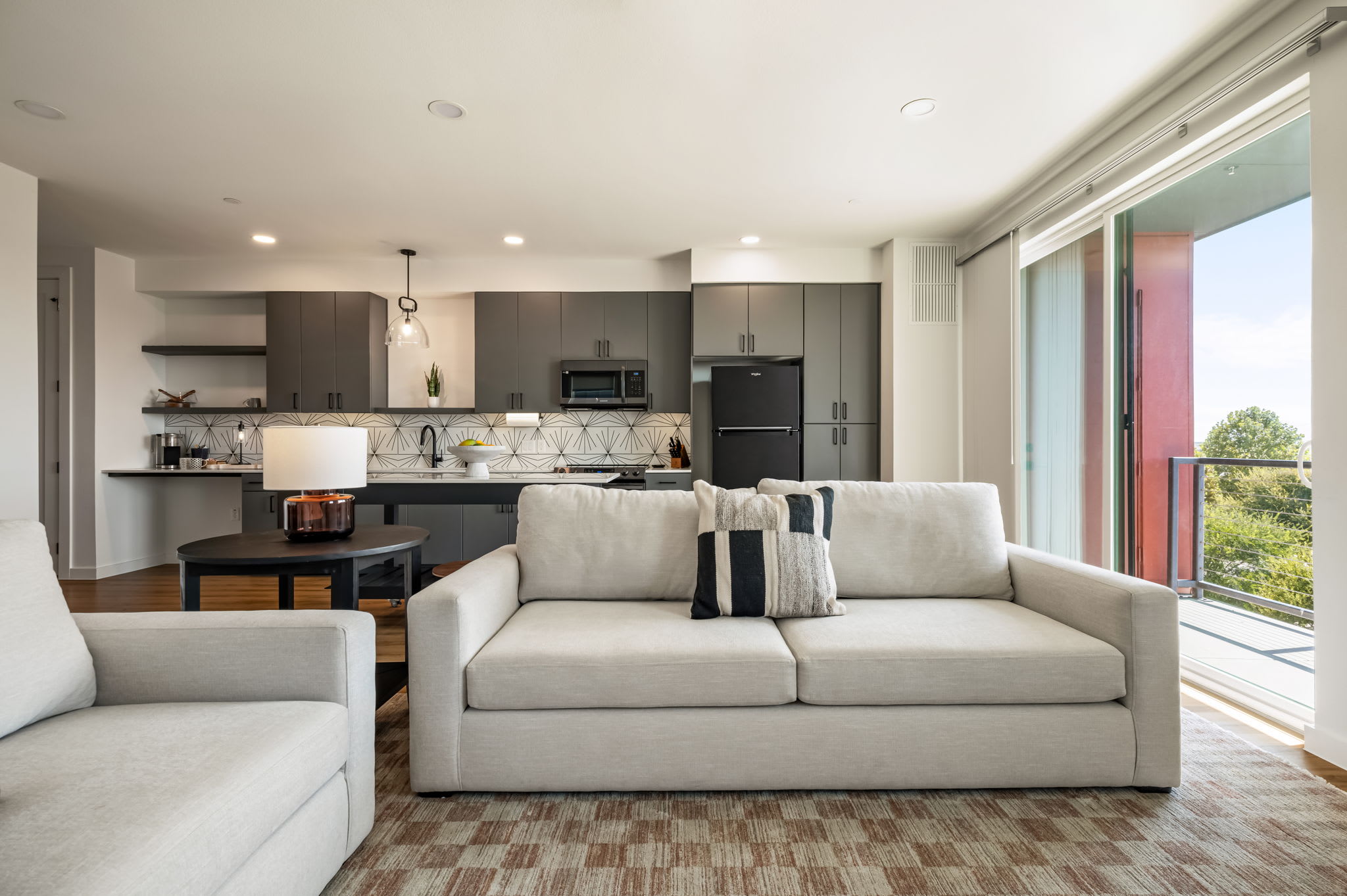 Living room with sofas and tall windows