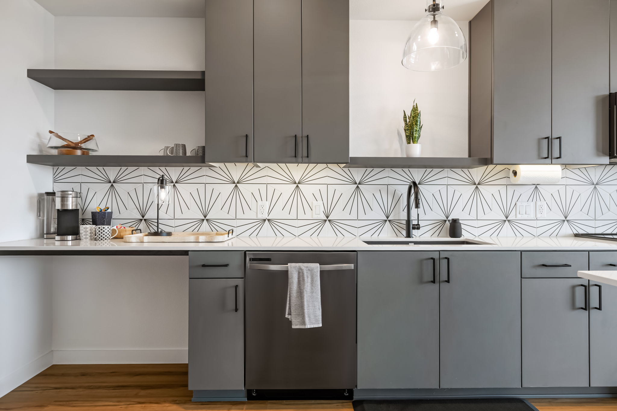 Kitchen with geometric tile backsplash