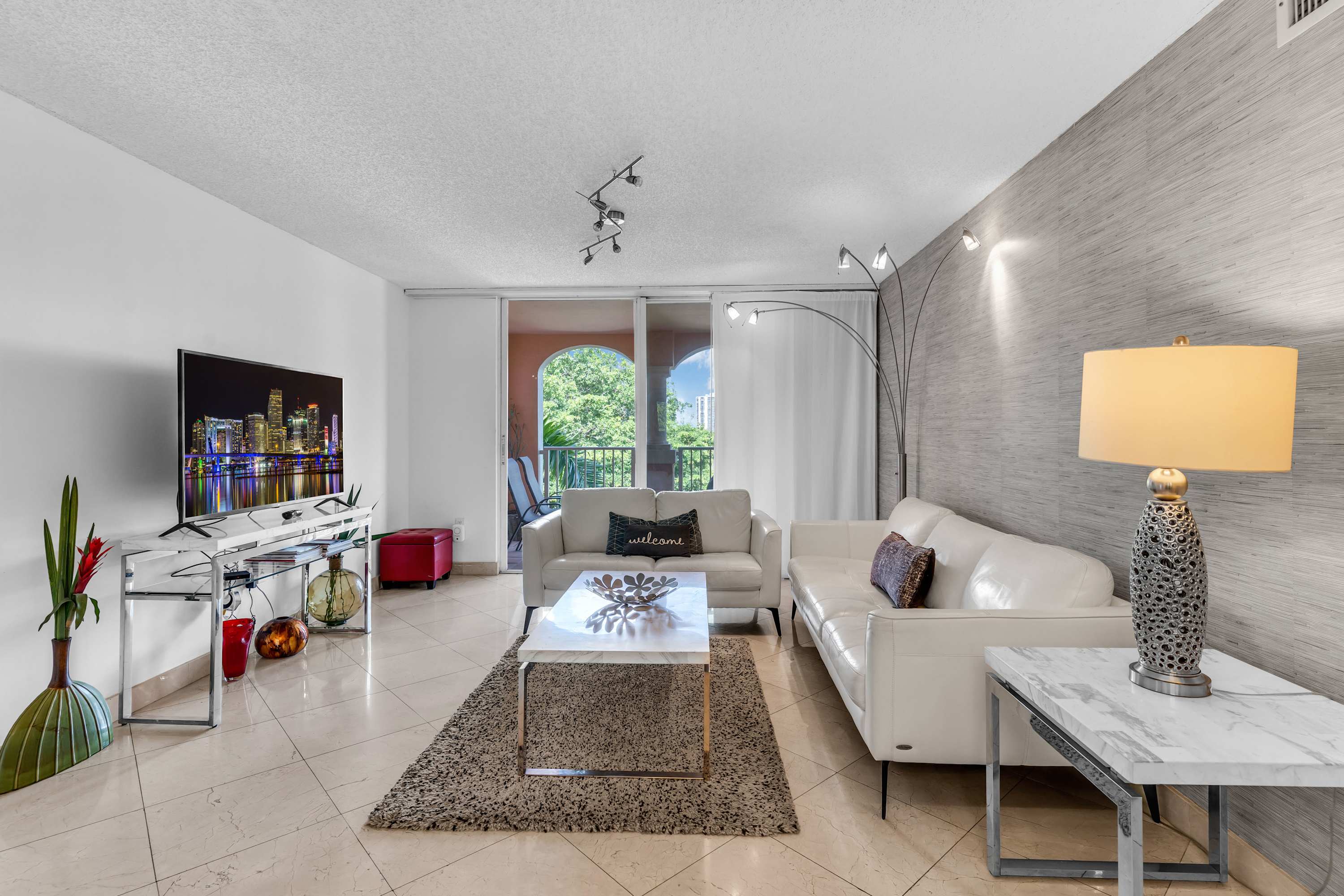 Unwind in the chic living room & stream your favorites on the smart TV​