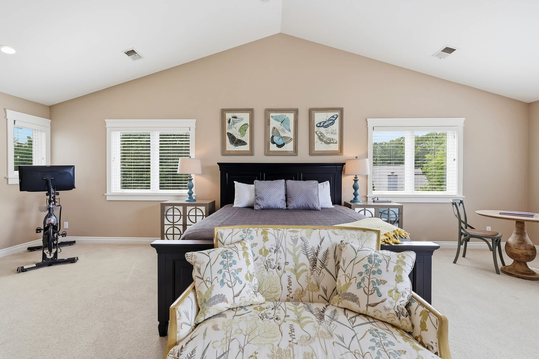 Primary bedroom is on the upper level & has a king-size bed.