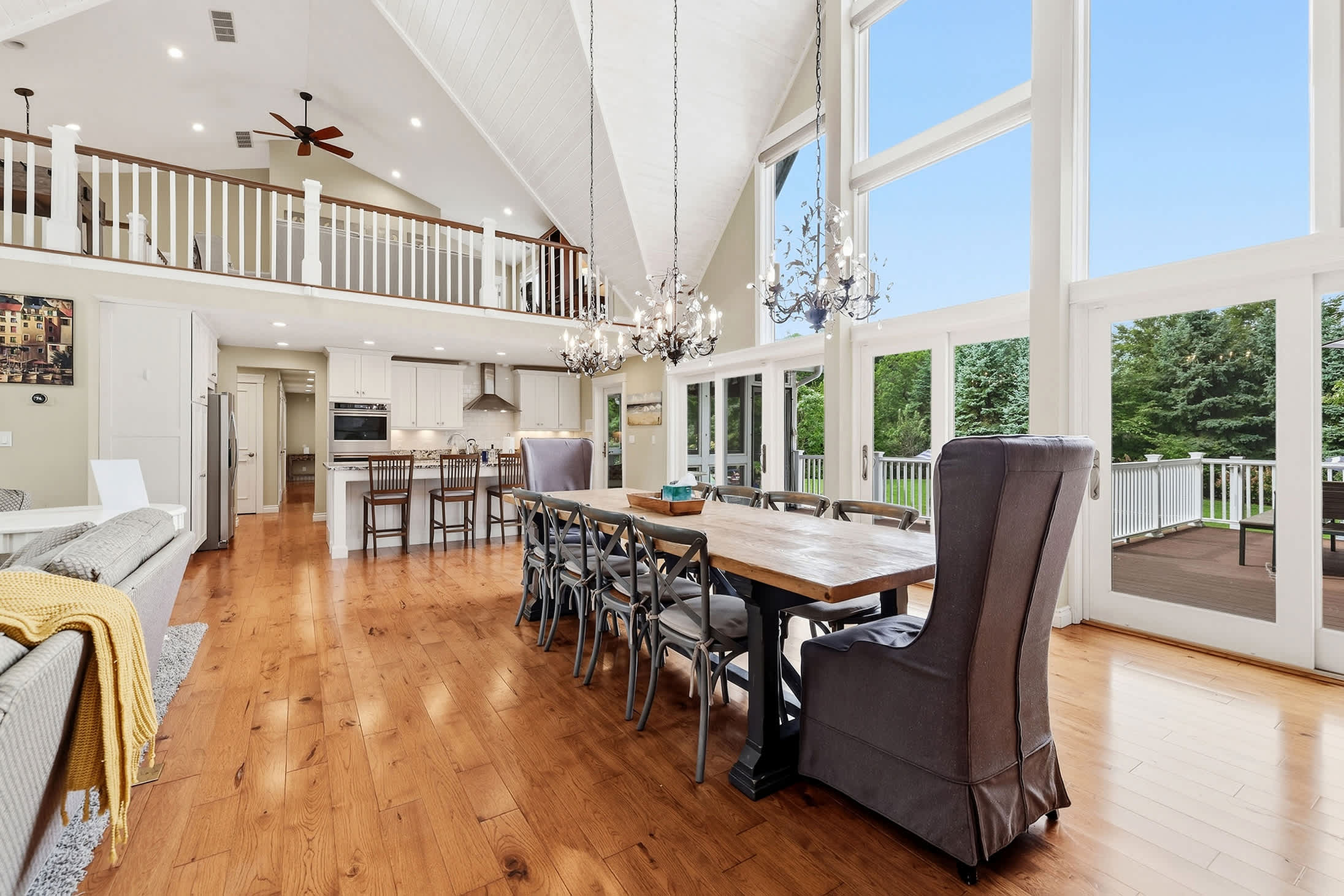 Open dining area with a spacious table and deck access.