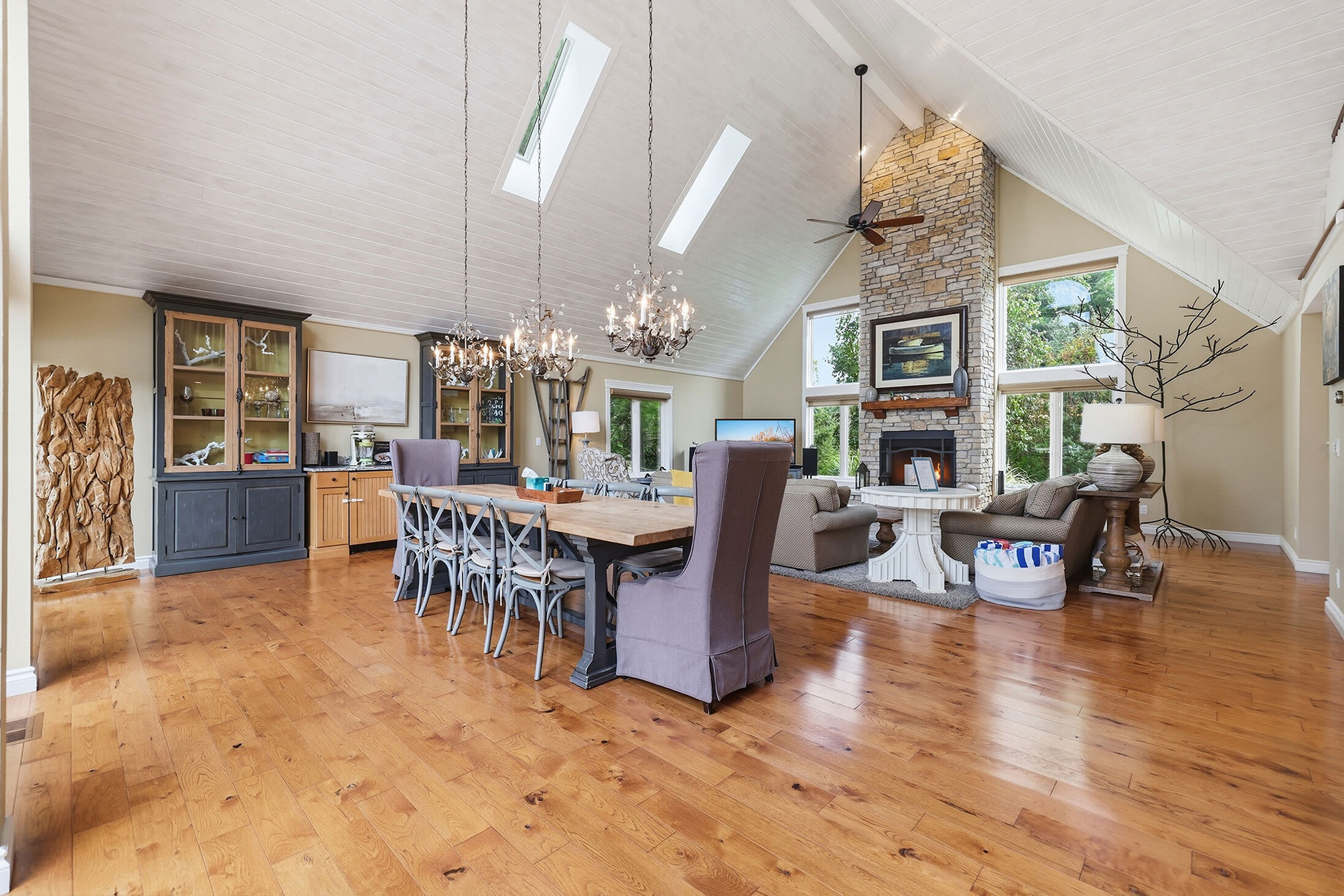 Great room with dining table, fireplace and spacious group seating.