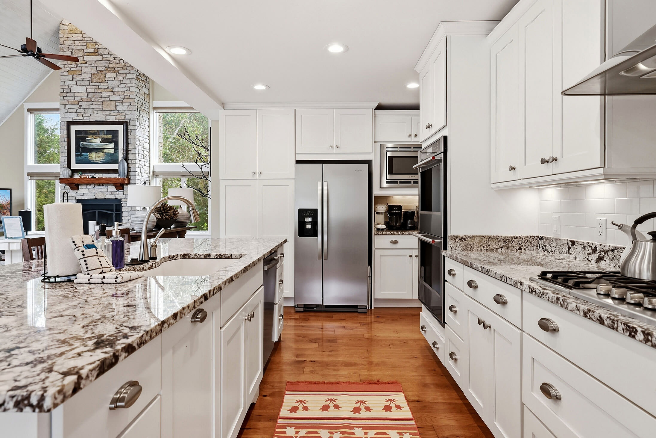 Kitchen with large island, double ovens and plenty of prep space.