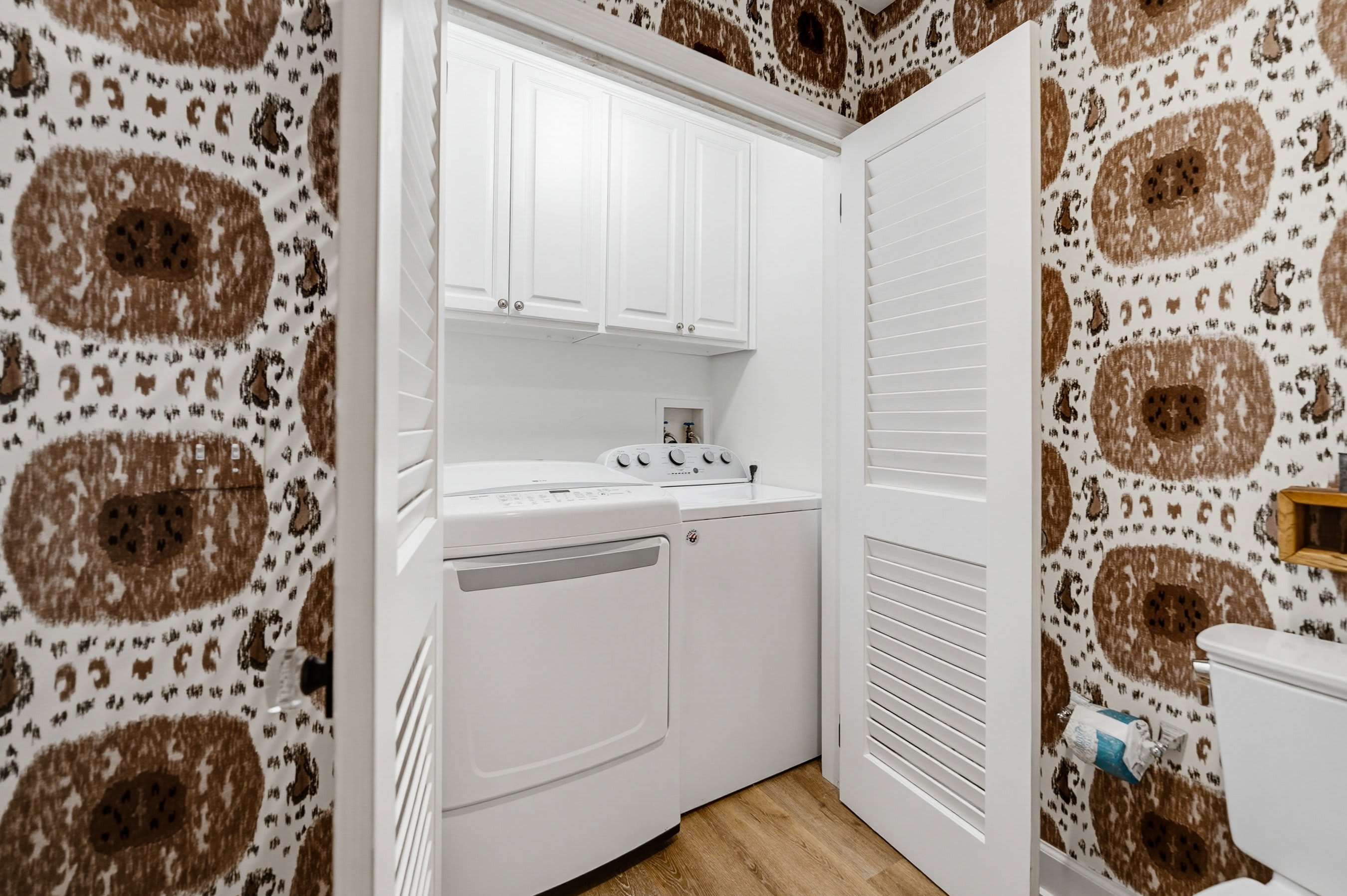 Shared Bathroom Upstairs with Tub Shower Combo and Laundry