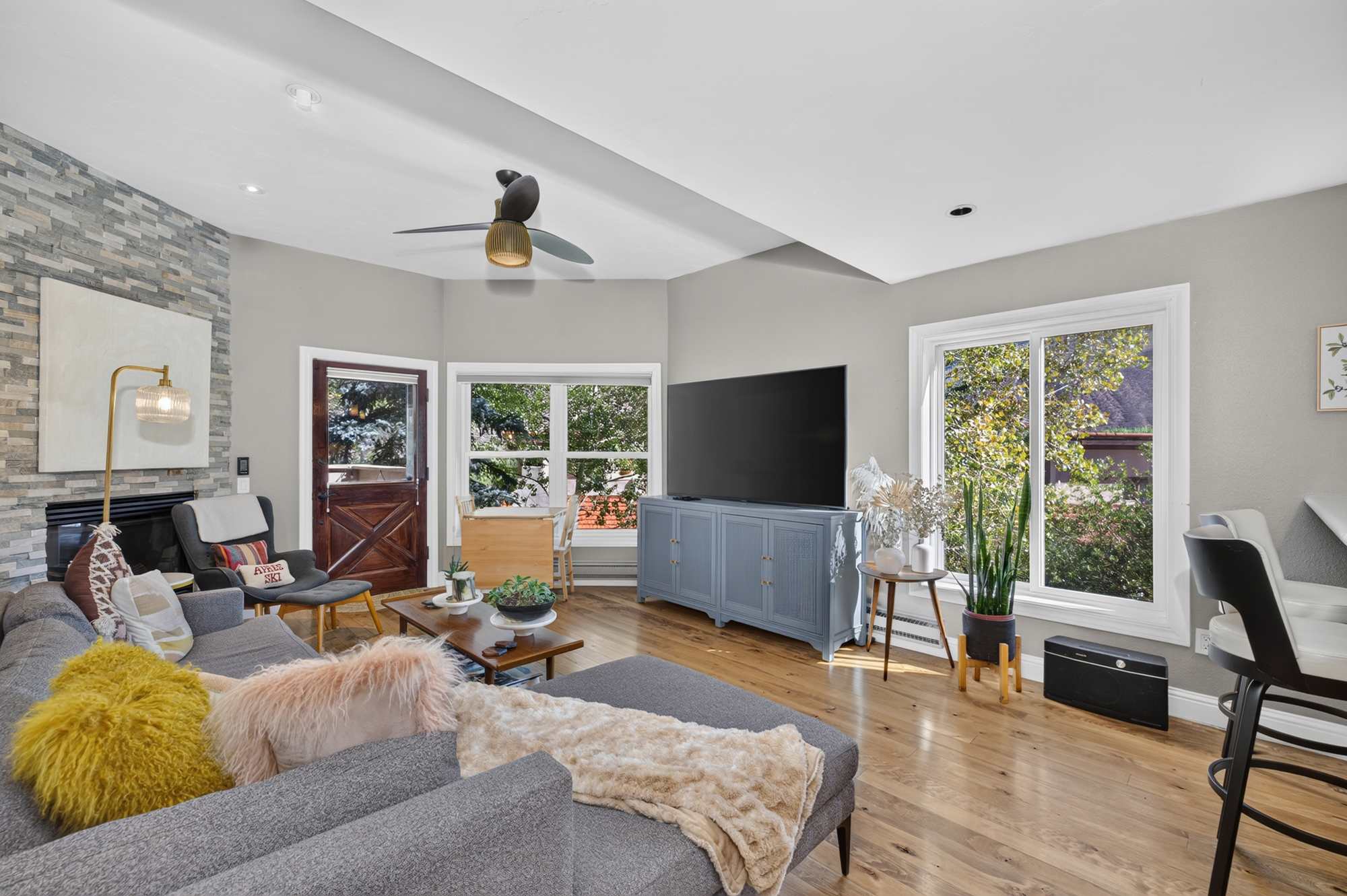 Relax in the spacious open living area with a cozy couch and Smart TV