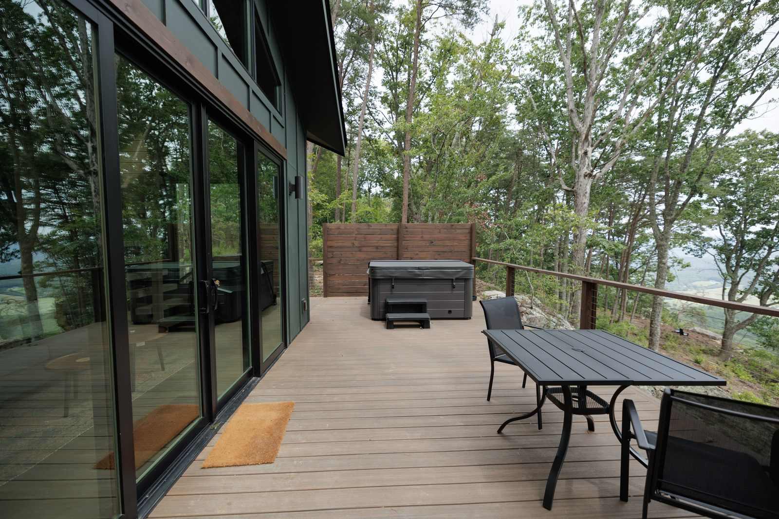 Enjoy morning coffee or an evening soak overlooking the peaceful valley.