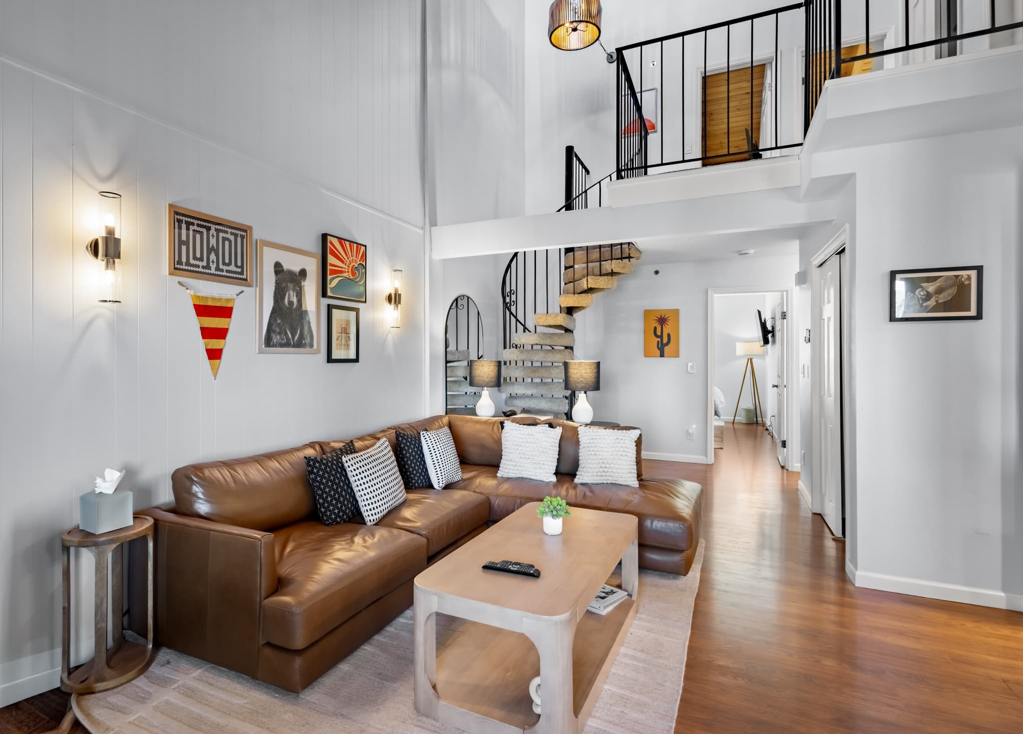 Relax in the spacious living area with a fireplace, large L-shaped couch, and cable TV