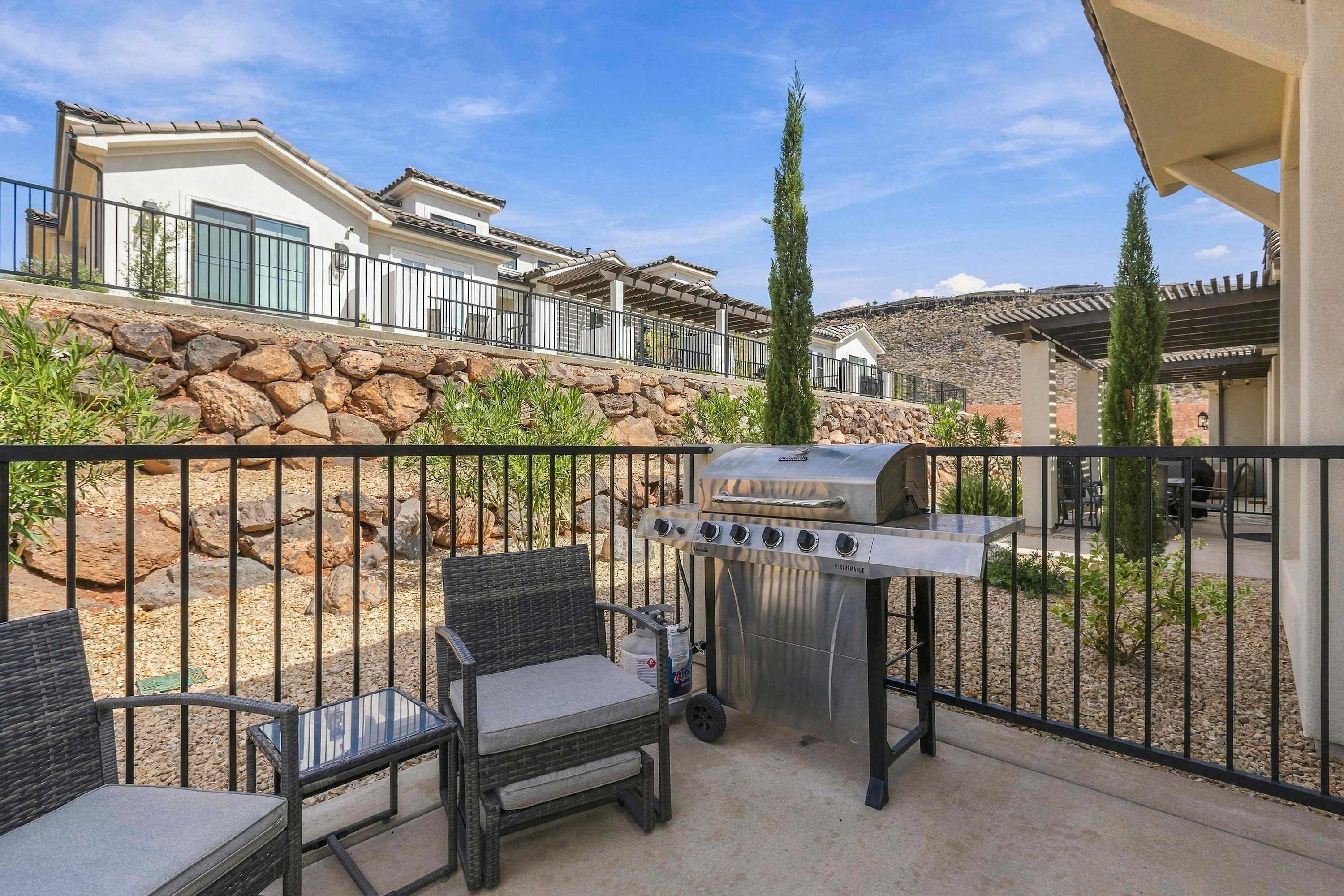 Enjoy the outdoors with cozy patio seating for two and a BBQ