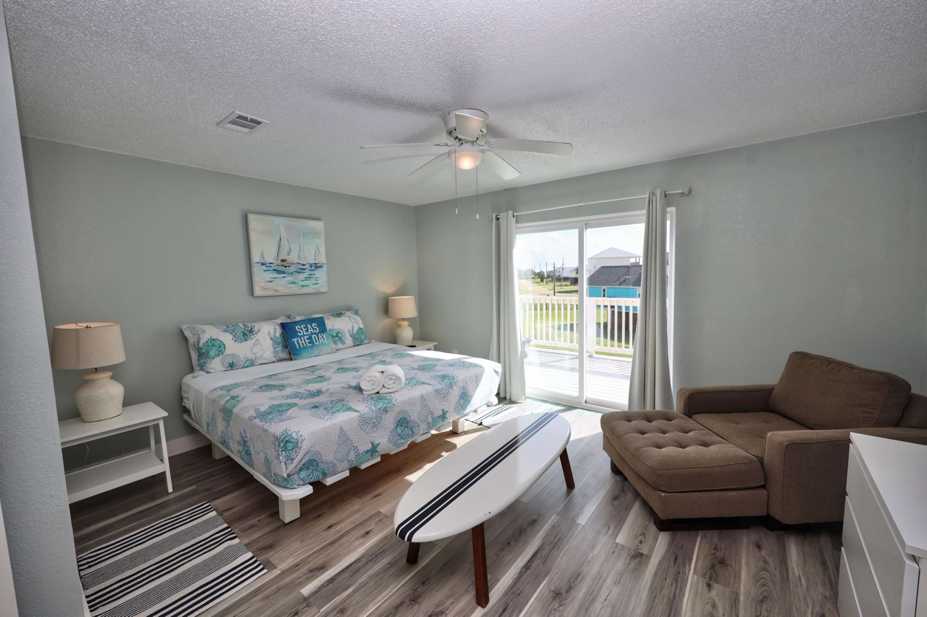 The second-floor king suite boasts a smart TV, private ensuite, & balcony​