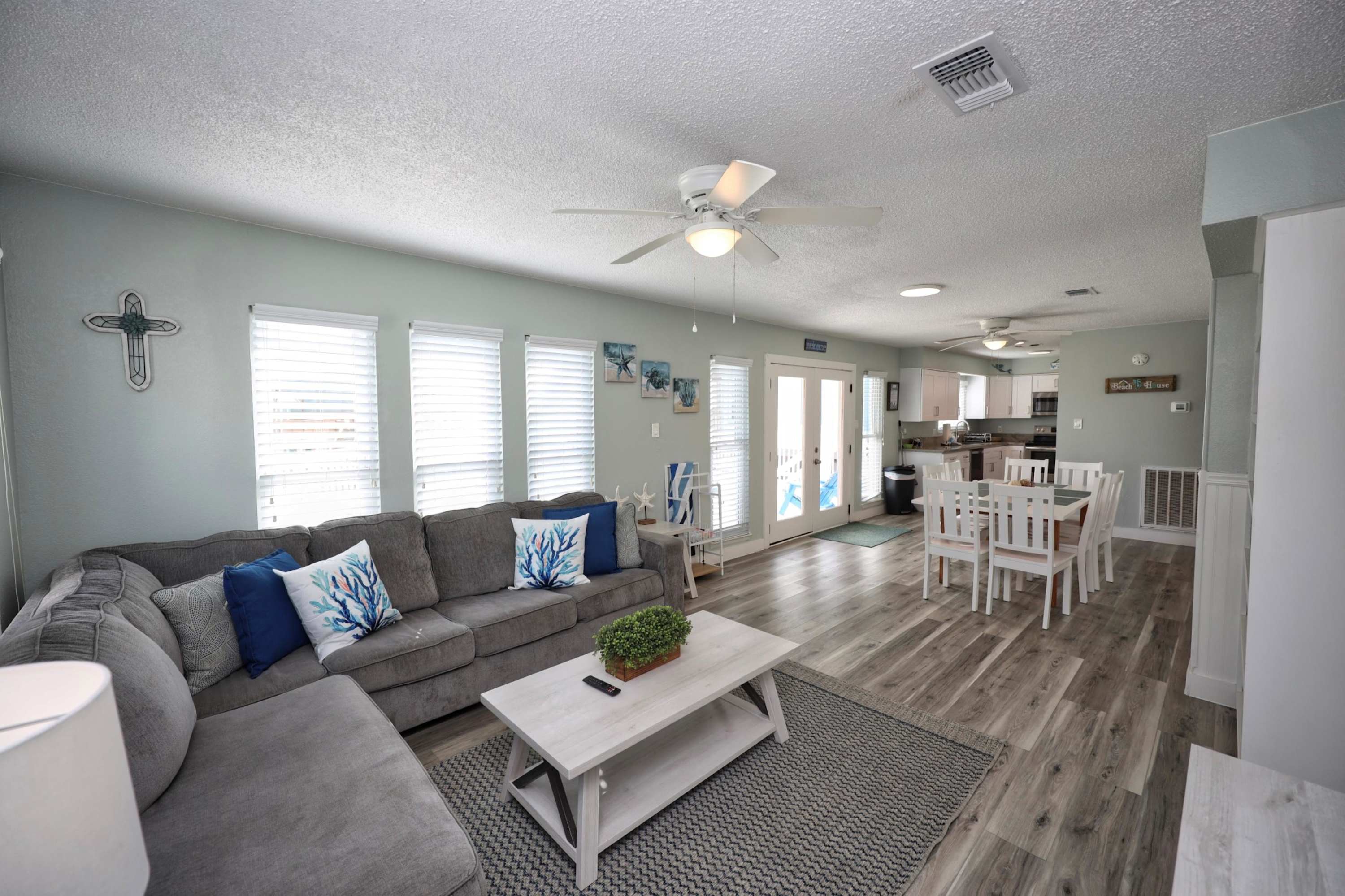 Unwind in the coastal chic living room & stream your favorites on the smart TV​