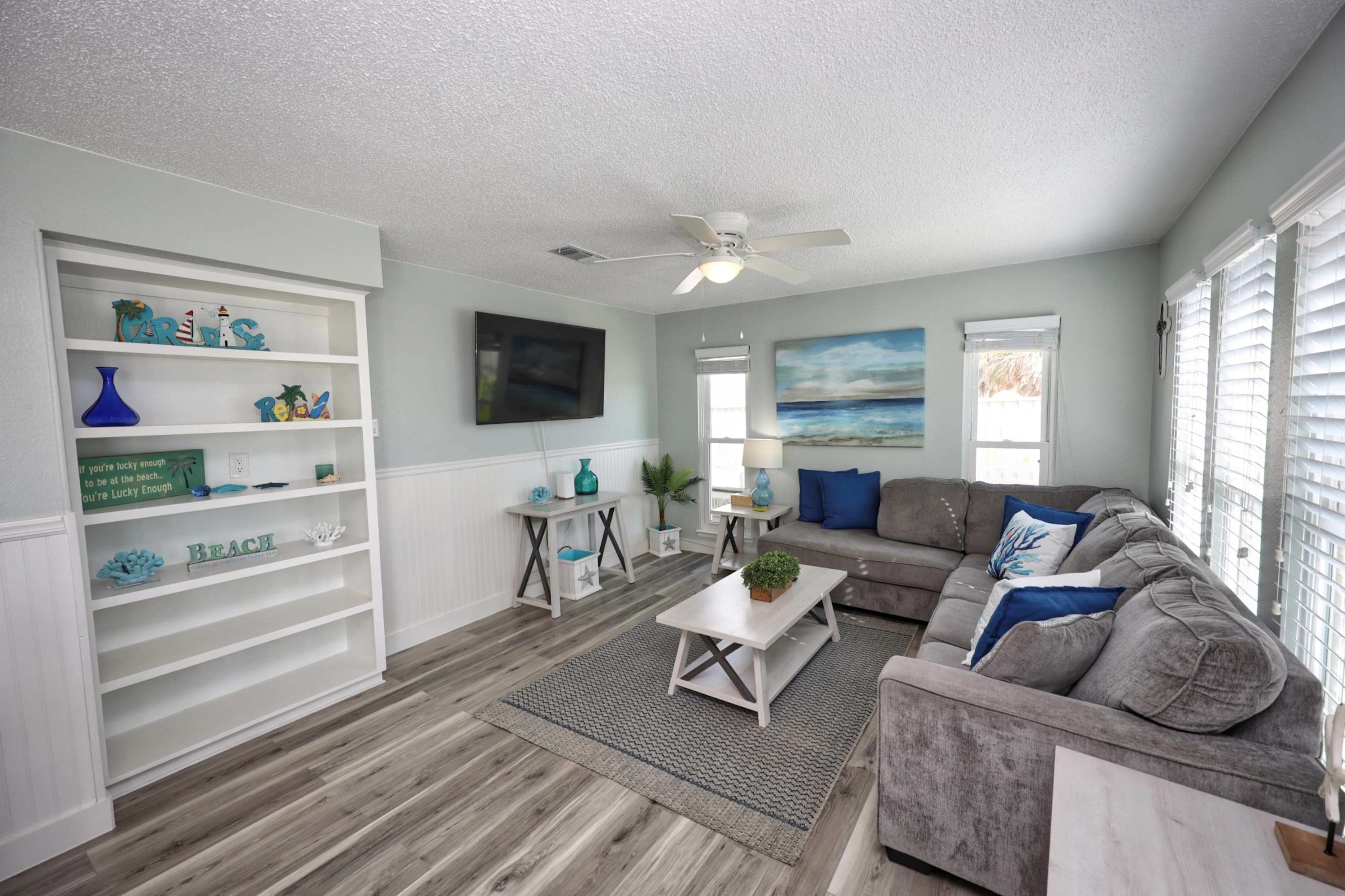 Unwind in the coastal chic living room & stream your favorites on the smart TV​