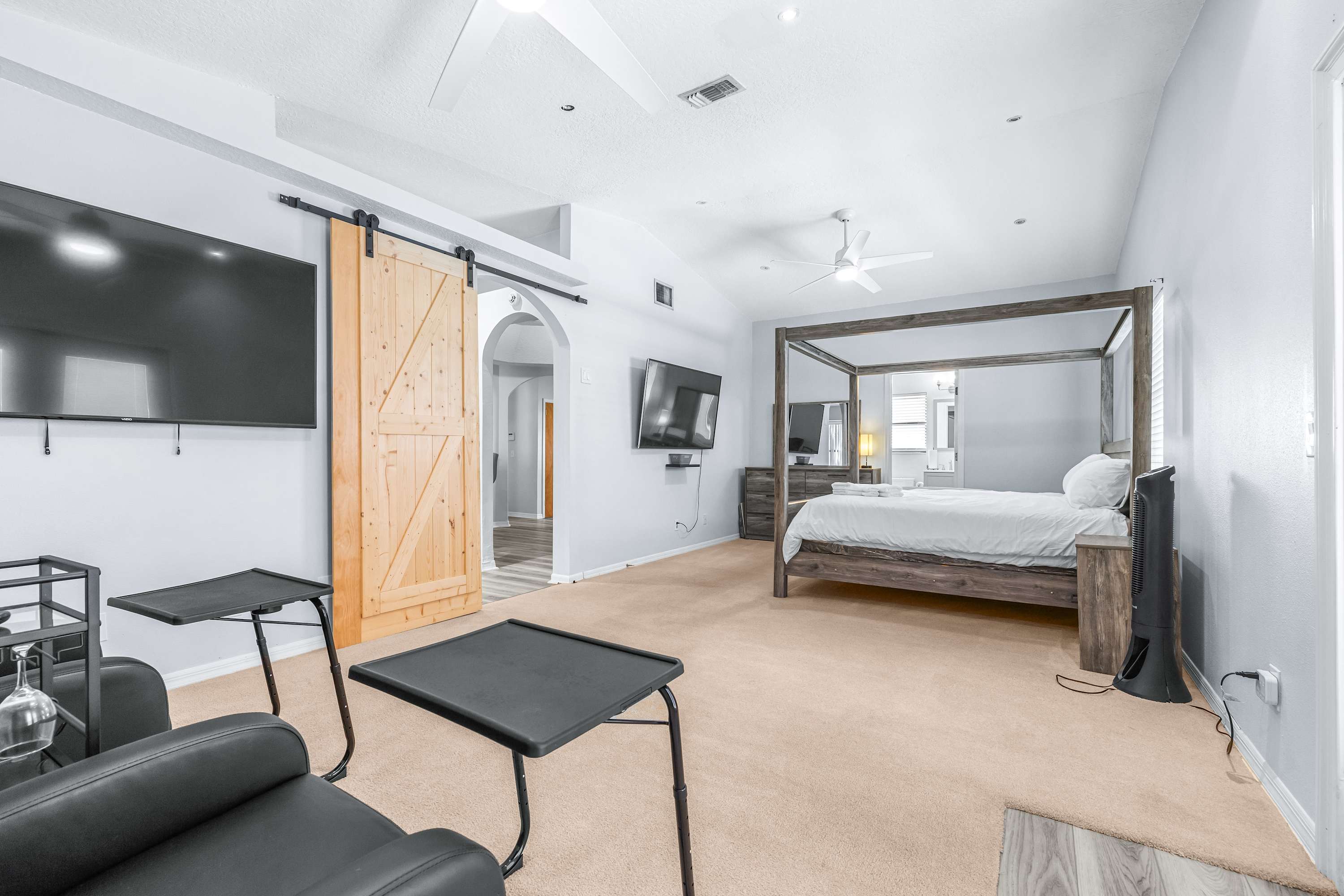 King-size comfort with a Smart TV, extra seating, and a full ensuite bathroom